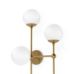 Featuring Armstrong Burnished Brass Opal Matte Glass 4 R Sconce by Four Hands at Amethyst Home. Matte glass spheres seem to extend and reach across smooth brass rods. Each globe is individually blown, shaped and sculpted by hand through a one-hour process. Matte globes are specially manufactured to evenly diffuse light. Brass and glass are 98% recyclable. D. Amethyst Home provides interior design, new home construction design consulting, vintage area rugs, and lighting in the Park City metro area.