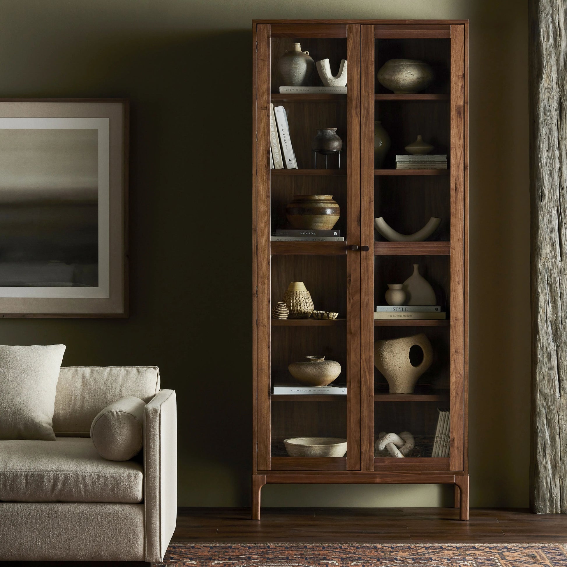 Framed panels, softened corners and tapered spindle legs speak to the vintage European inspiration behind this spacious cabinetry style. Made from natural-finished walnut and walnut veneer Amethyst Home provides interior design, new home construction design consulting, vintage area rugs, and lighting in the Miami metro area.