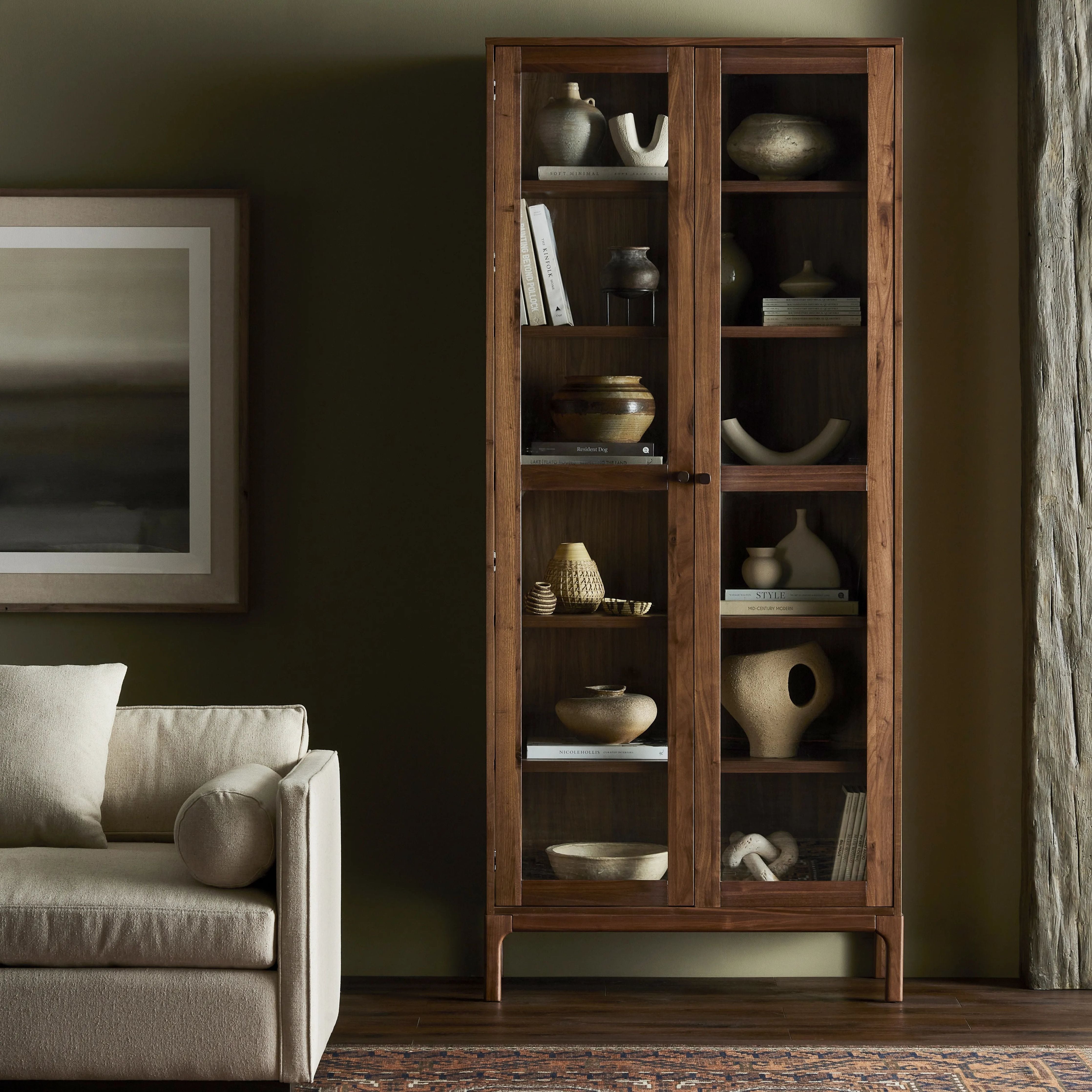 Framed panels, softened corners and tapered spindle legs speak to the vintage European inspiration behind this spacious cabinetry style. Made from natural-finished walnut and walnut veneer Amethyst Home provides interior design, new home construction design consulting, vintage area rugs, and lighting in the Miami metro area.