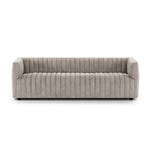 A dramatically channeled sofa with textural grey upholstery offers a clean look inspired by modern menswear. Amethyst Home provides interior design, new construction, custom furniture, and area rugs in the Los Angeles metro area.