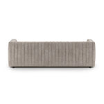 A dramatically channeled sofa with textural grey upholstery offers a clean look inspired by modern menswear. Amethyst Home provides interior design, new construction, custom furniture, and area rugs in the Monterey metro area.