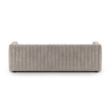 A dramatically channeled sofa with textural grey upholstery offers a clean look inspired by modern menswear. Amethyst Home provides interior design, new construction, custom furniture, and area rugs in the Monterey metro area.
