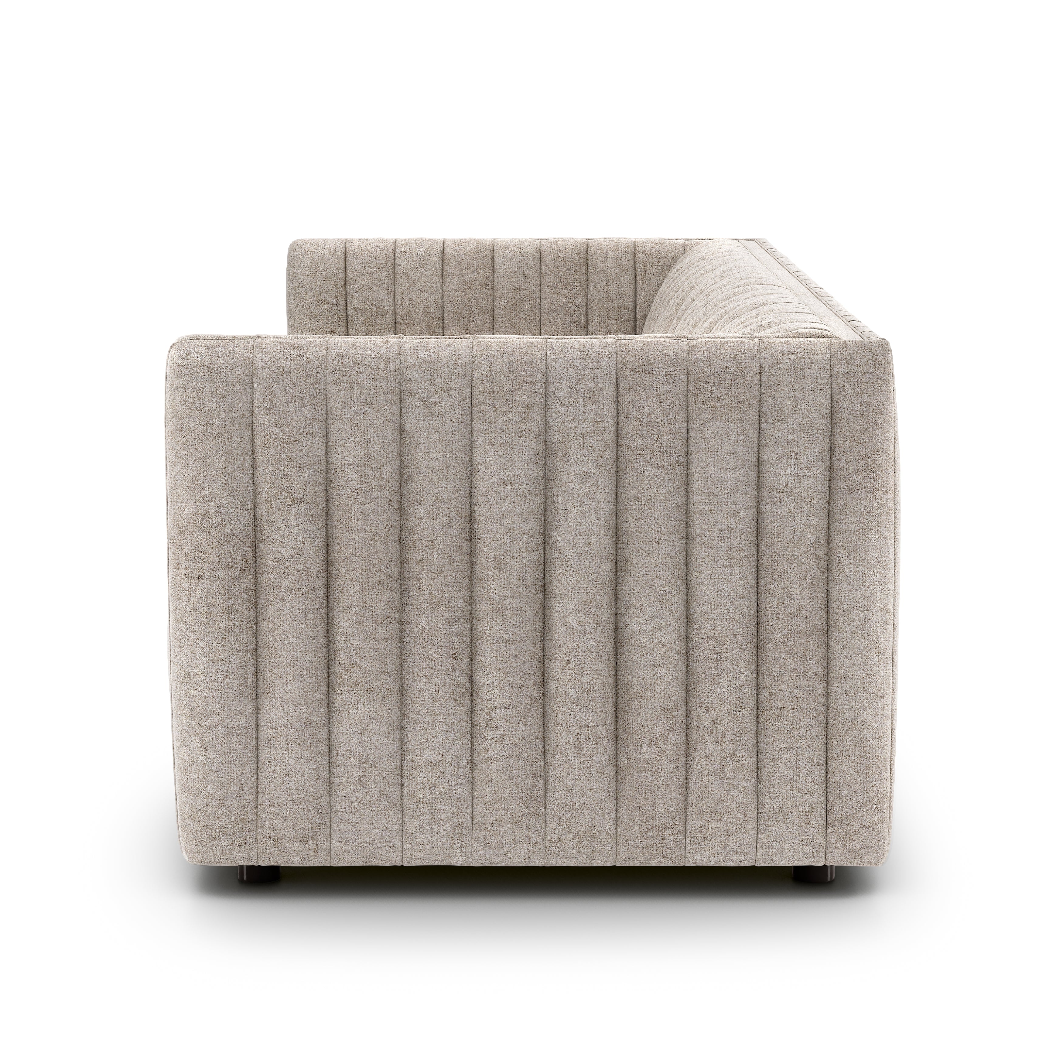 A dramatically channeled sofa with textural grey upholstery offers a clean look inspired by modern menswear. Amethyst Home provides interior design, new construction, custom furniture, and area rugs in the Newport Beach metro area.