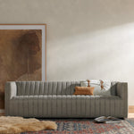 A dramatically channeled sofa with textural grey upholstery offers a clean look inspired by modern menswear. Amethyst Home provides interior design, new construction, custom furniture, and area rugs in the San Diego metro area.
