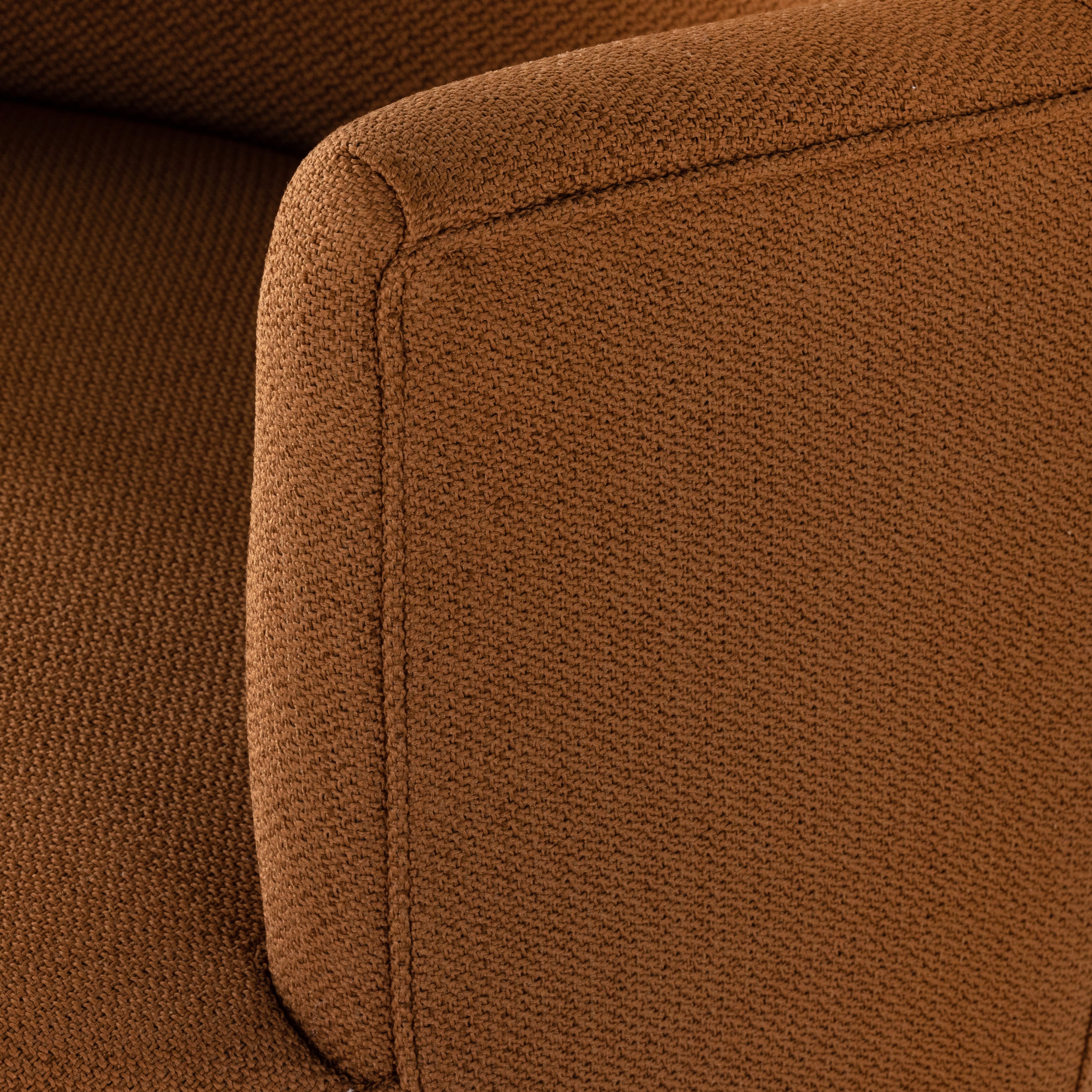 Intriguing while inviting. Drum-style seating is upholstered in a soothing and warm rust umber hue. A swivel base of natural parawood places a fresh spin on a feminine form. Amethyst Home provides interior design, new construction, custom furniture, and area rugs in the Kansas City metro area.