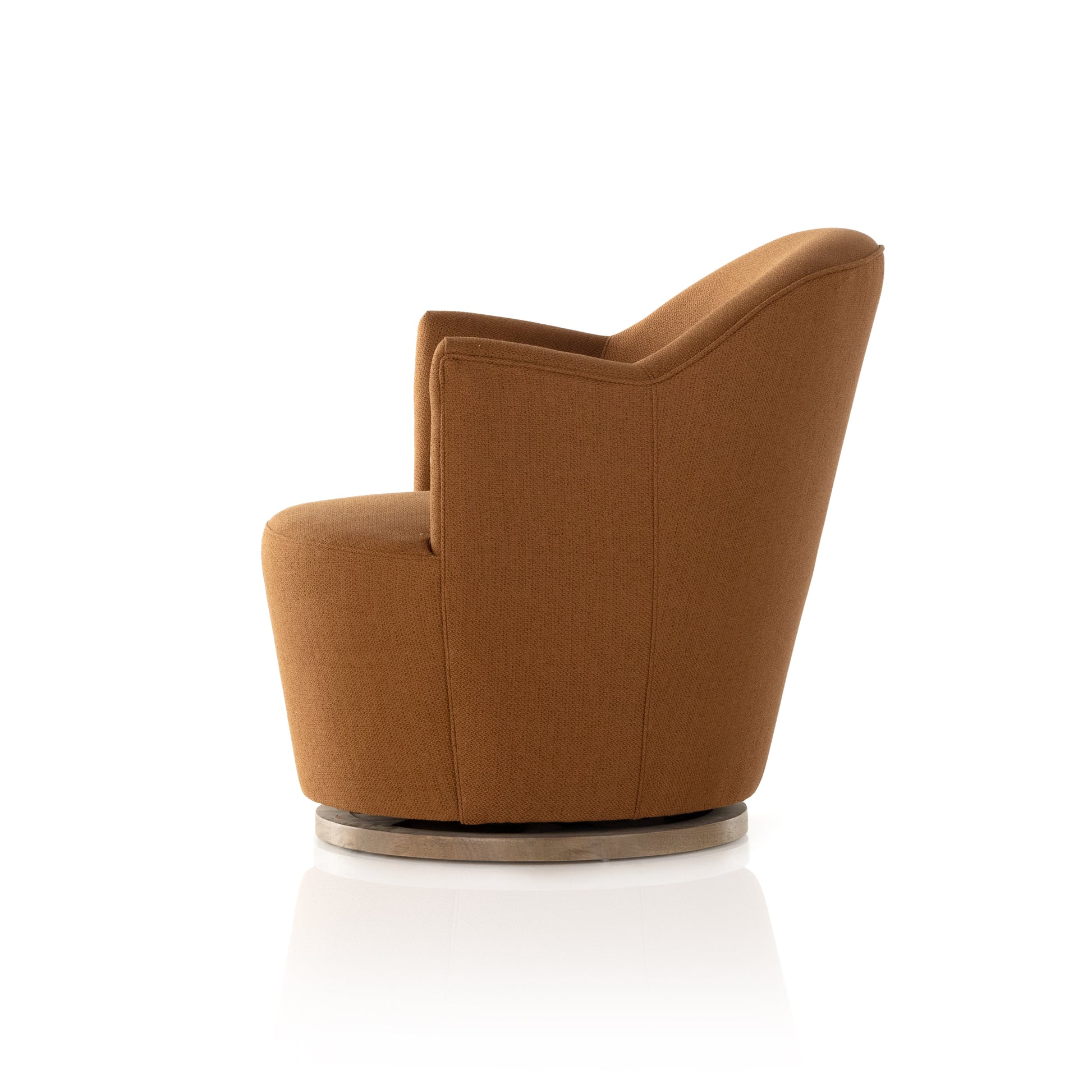 Intriguing while inviting. Drum-style seating is upholstered in a soothing and warm rust umber hue. A swivel base of natural parawood places a fresh spin on a feminine form. Amethyst Home provides interior design, new construction, custom furniture, and area rugs in the Portland metro area.