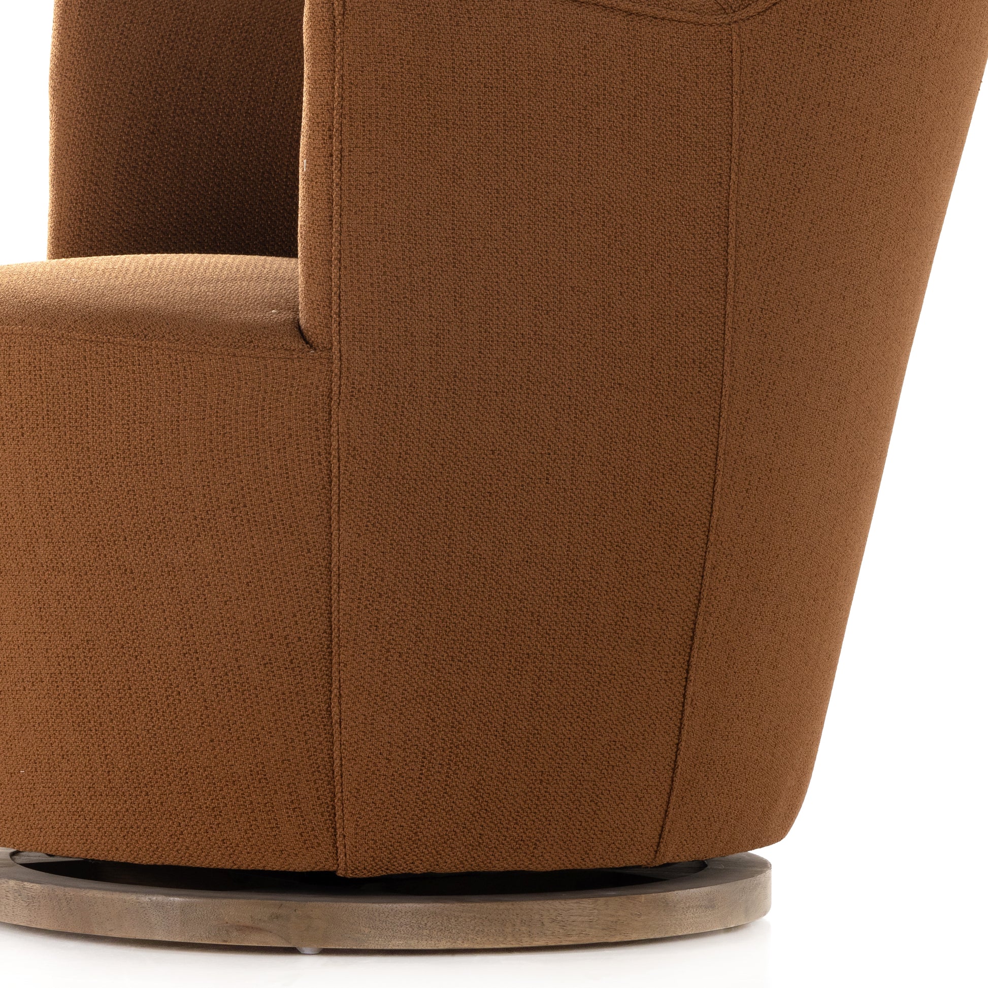 Intriguing while inviting. Drum-style seating is upholstered in a soothing and warm rust umber hue. A swivel base of natural parawood places a fresh spin on a feminine form. Amethyst Home provides interior design, new construction, custom furniture, and area rugs in the Washington metro area.
