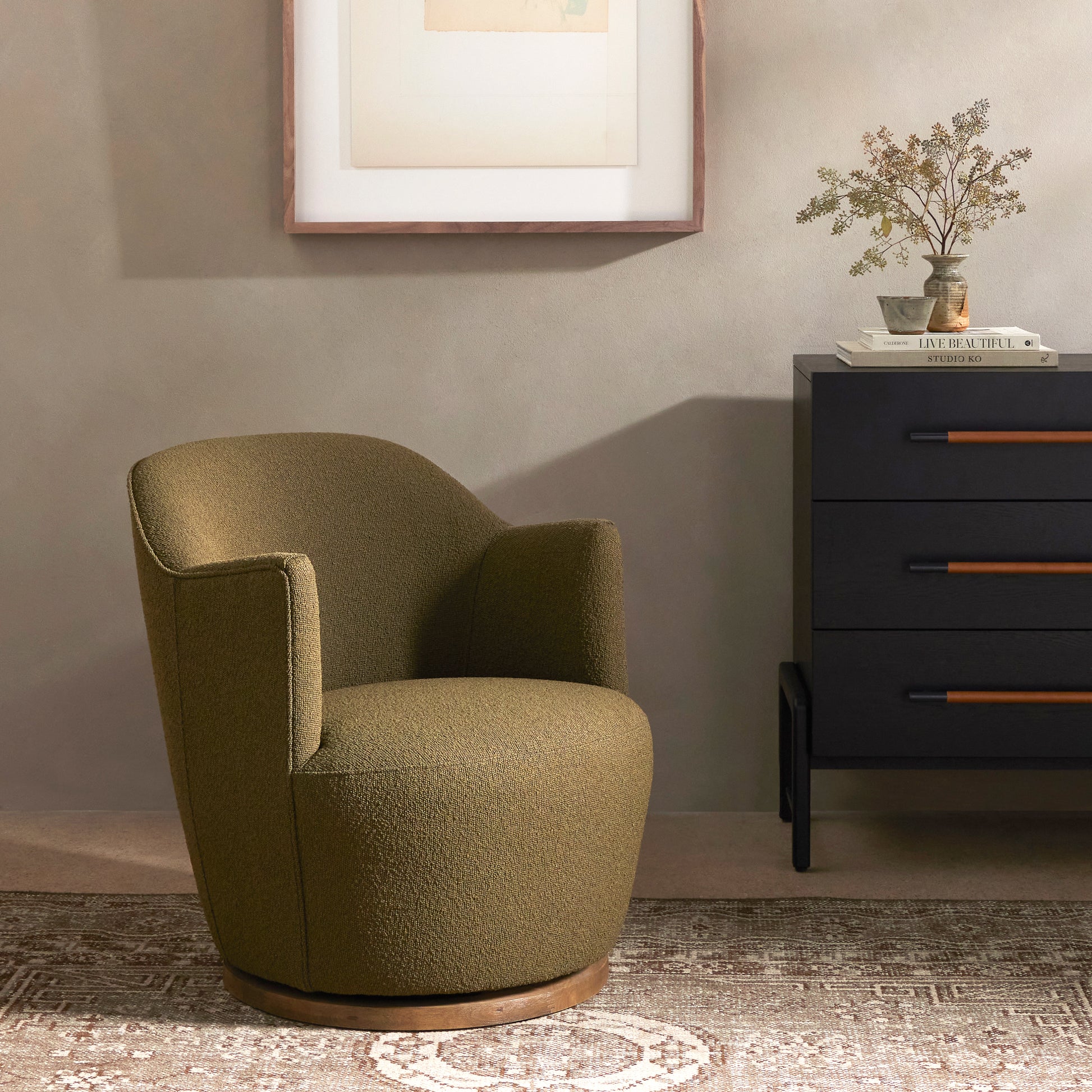 Intriguing while inviting. Drum-style seating is upholstered in a soothing and textural olive boucle. A swivel base of distressed natural parawood places a fresh spin on a feminine form. Performance fabrics are specially created to withstand spills, stains, high traffic and wear, ensuring long-term comfort and unmatched durability. Amethyst Home provides interior design, new construction, custom furniture and area rugs in the Miami metro area