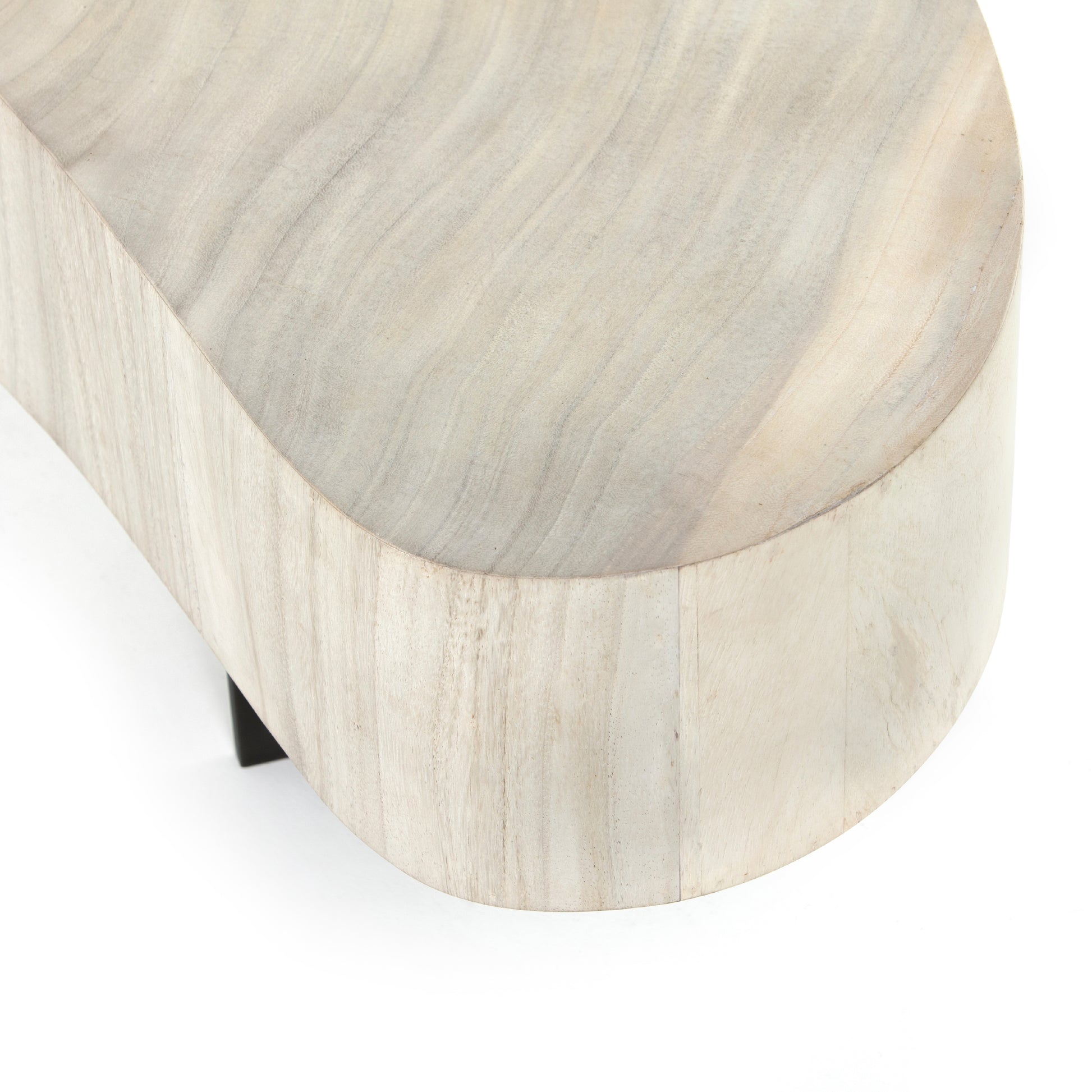 Natural beauty - total novelty. A thick slab of bleached, oyster-cut Guanacaste forms a tall, kidney-shaped coffee table. Visible rings speak to woods' natural graining, while a dark gunmetal-finished base provides clean contrast to the whole look. Amethyst Home provides interior design, new construction, custom furniture, and area rugs in the Calabasas metro area.