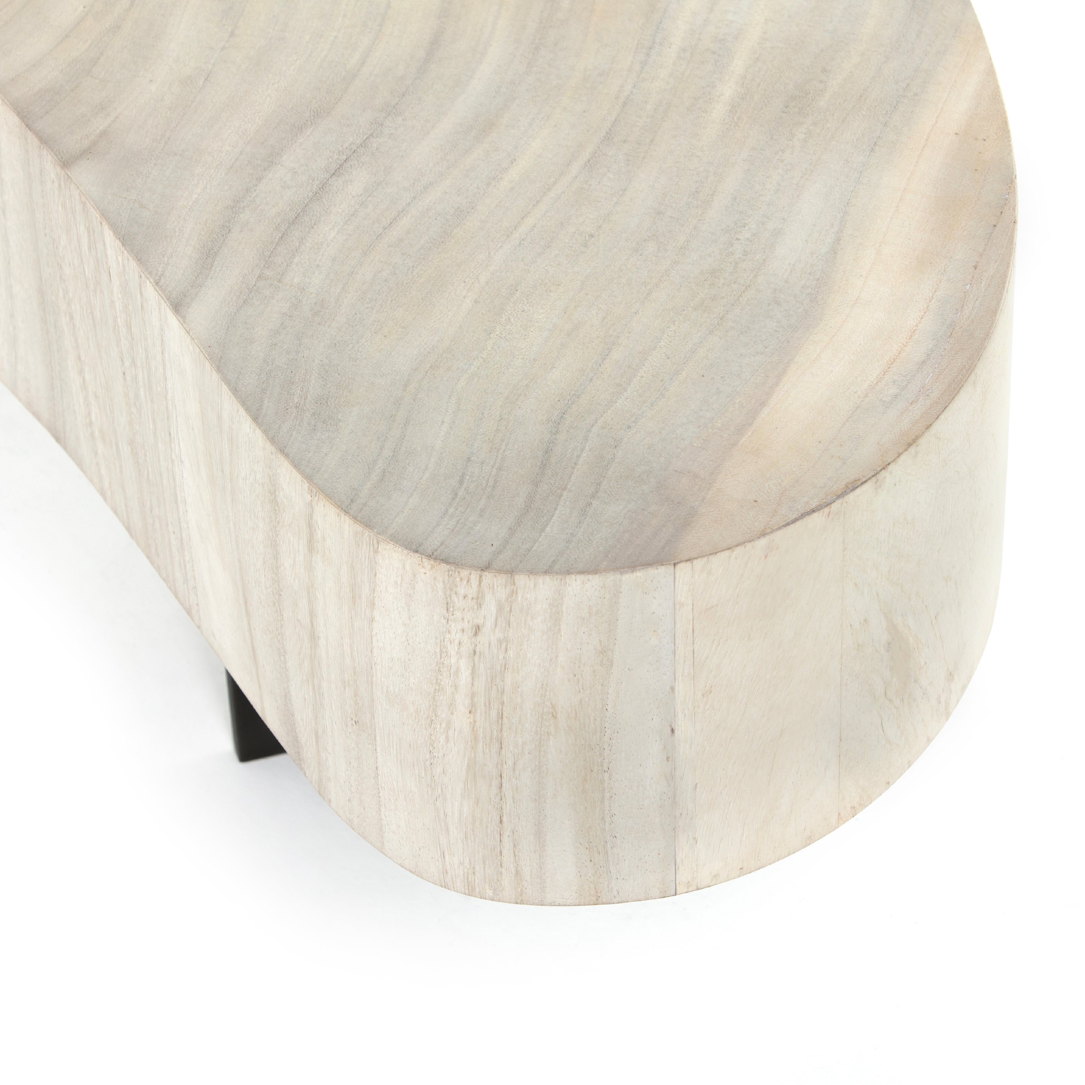 Natural beauty - total novelty. A thick slab of bleached, oyster-cut Guanacaste forms a tall, kidney-shaped coffee table. Visible rings speak to woods' natural graining, while a dark gunmetal-finished base provides clean contrast to the whole look. Amethyst Home provides interior design, new construction, custom furniture, and area rugs in the Calabasas metro area.