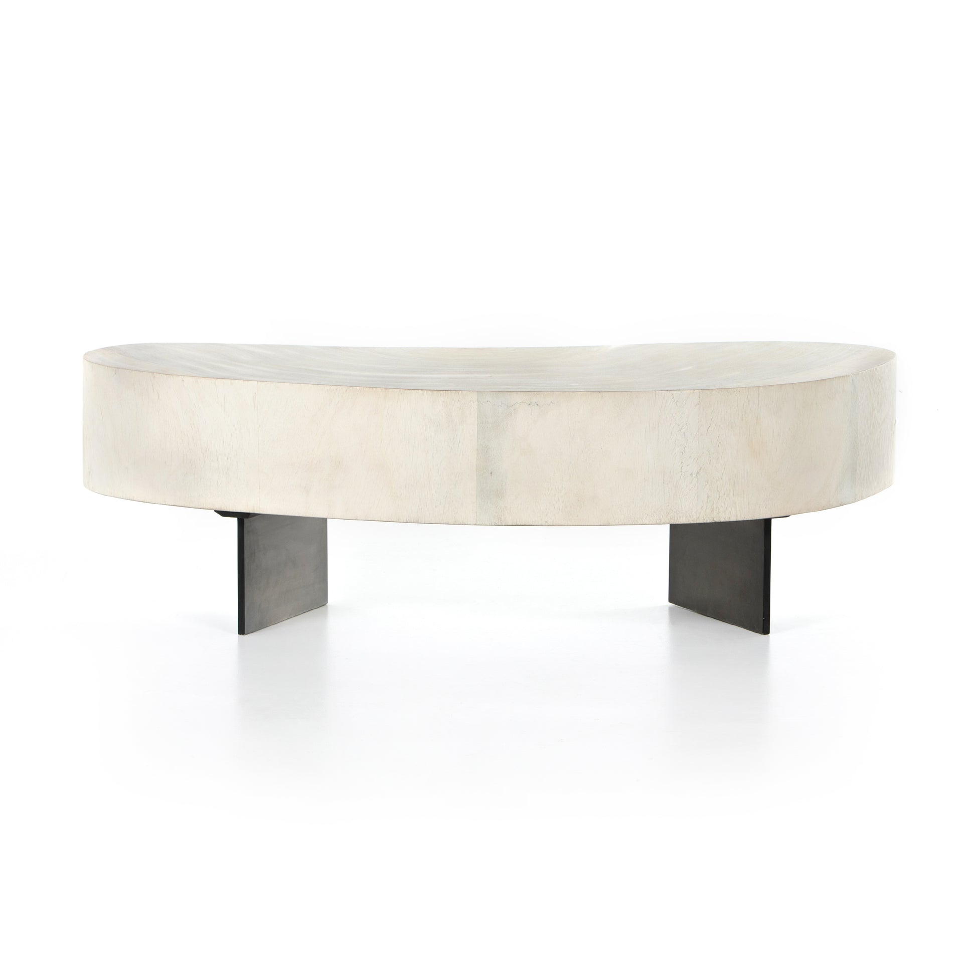 Natural beauty - total novelty. A thick slab of bleached, oyster-cut Guanacaste forms a tall, kidney-shaped coffee table. Visible rings speak to woods' natural graining, while a dark gunmetal-finished base provides clean contrast to the whole look. Amethyst Home provides interior design, new construction, custom furniture, and area rugs in the Dallas metro area.