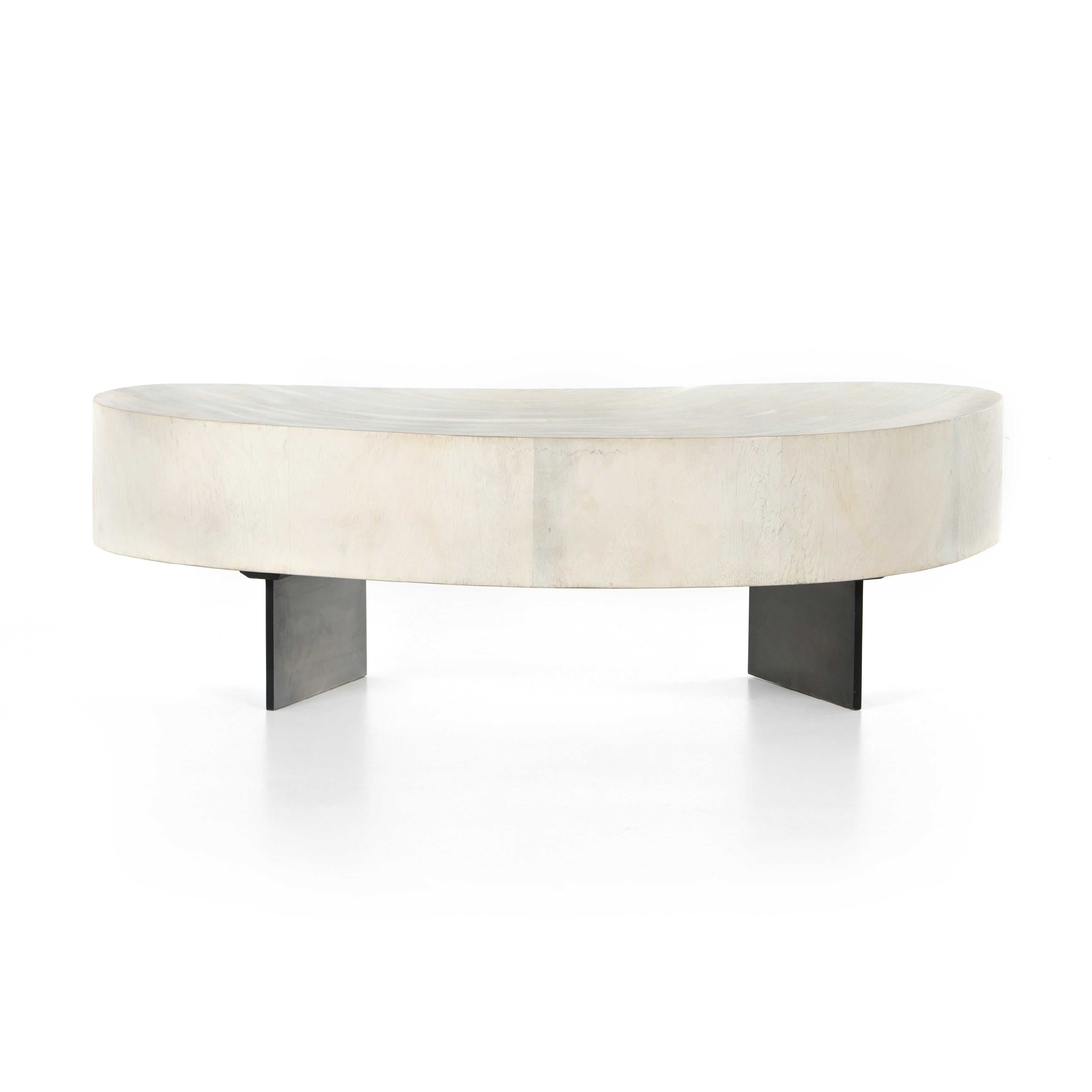 Natural beauty - total novelty. A thick slab of bleached, oyster-cut Guanacaste forms a tall, kidney-shaped coffee table. Visible rings speak to woods' natural graining, while a dark gunmetal-finished base provides clean contrast to the whole look. Amethyst Home provides interior design, new construction, custom furniture, and area rugs in the Dallas metro area.
