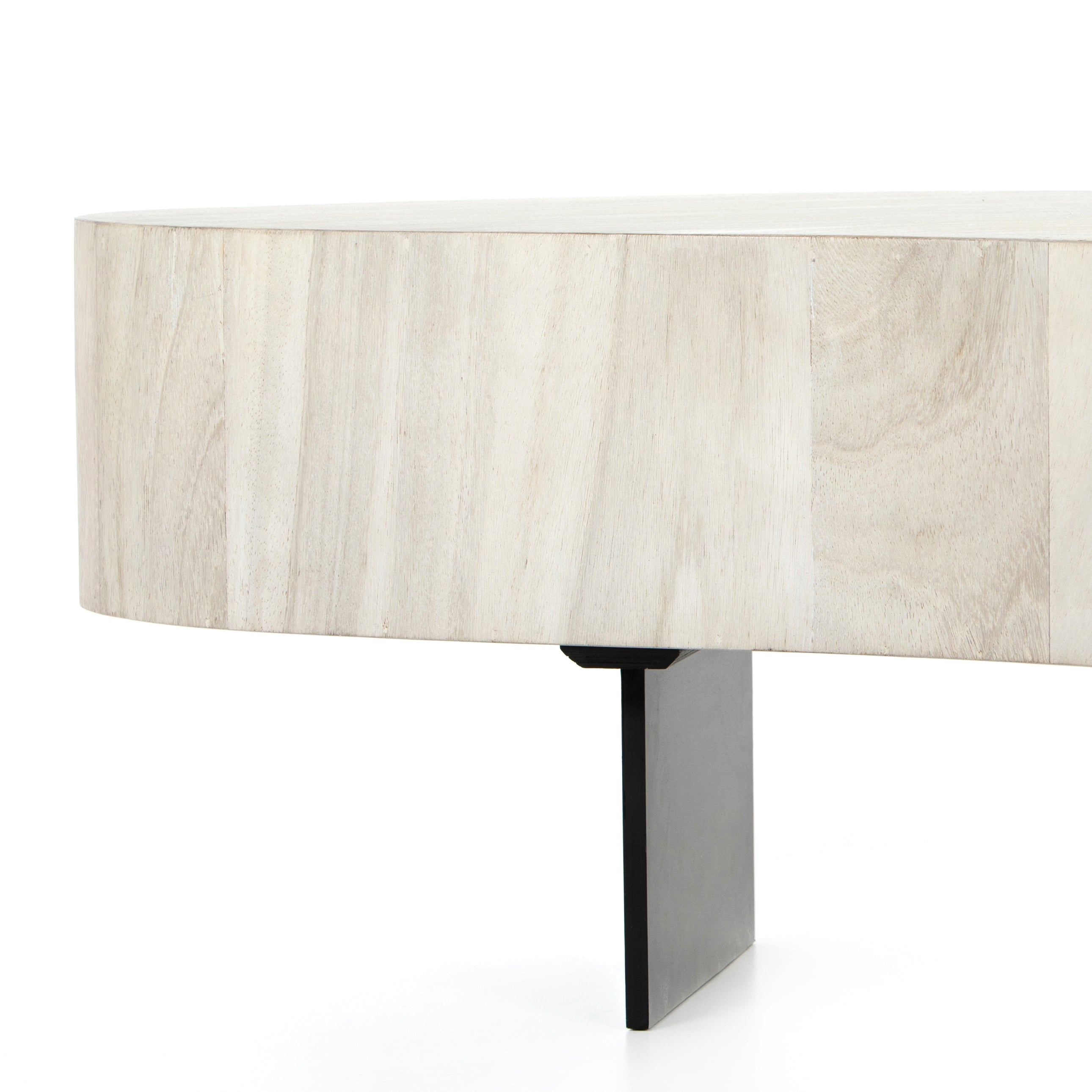 Natural beauty - total novelty. A thick slab of bleached, oyster-cut Guanacaste forms a tall, kidney-shaped coffee table. Visible rings speak to woods' natural graining, while a dark gunmetal-finished base provides clean contrast to the whole look. Amethyst Home provides interior design, new construction, custom furniture, and area rugs in the Laguna Beach metro area.