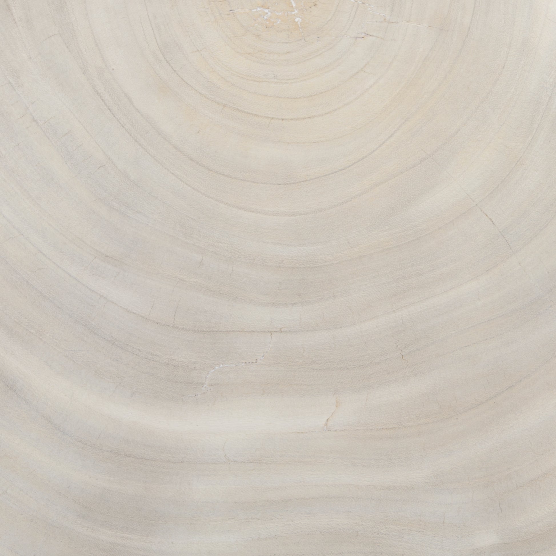 Natural beauty - total novelty. A thick slab of bleached, oyster-cut Guanacaste forms a tall, kidney-shaped coffee table. Visible rings speak to woods' natural graining, while a dark gunmetal-finished base provides clean contrast to the whole look. Amethyst Home provides interior design, new construction, custom furniture, and area rugs in the San Diego metro area.