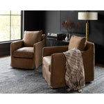 Introducing the Banks Palermo Drift Swivel Chair, the perfect addition to any moody room. Please expect natural distressing, adding character and charm to the chair. Pair it with Sherwin Williams Pewter Green walls and Surya rugs for a cohesive look. Whether you're in Nashville, Florida, or Utah, this chair will seamlessly blend with any modern coastal-inspired home design. Add the Banks Palermo Drift Swivel Chair to your living room or bedroom for a touch of sophistication and comfort.