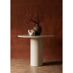 Simply sophisticated. A bistro-style table inspired by 1970s Italian design, an ivory-finished iron base supports a rounded tabletop of cream-colored solid marble, for a fresh, monochromatic look that pairs with just about anything. Amethyst Home provides interior design, new construction, custom furniture and area rugs in the Park City metro area