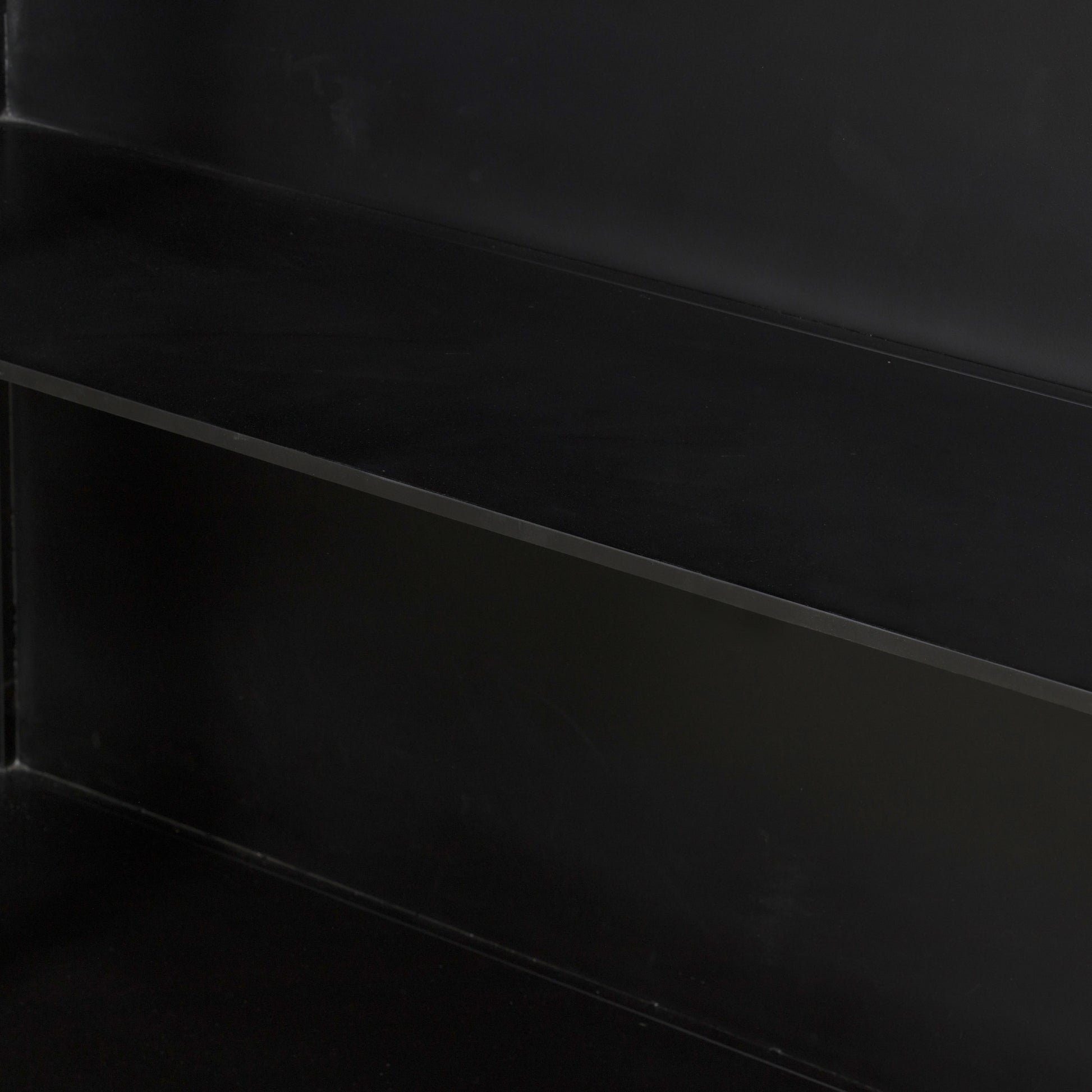Display barware, books and keepsakes in wide, beautifully arched cabinetry. Solid iron sheeting is finished in a soft, matte black with contrasting brass hardware. Amethyst Home provides interior design, new construction, custom furniture, and area rugs in the Newport Beach metro area.