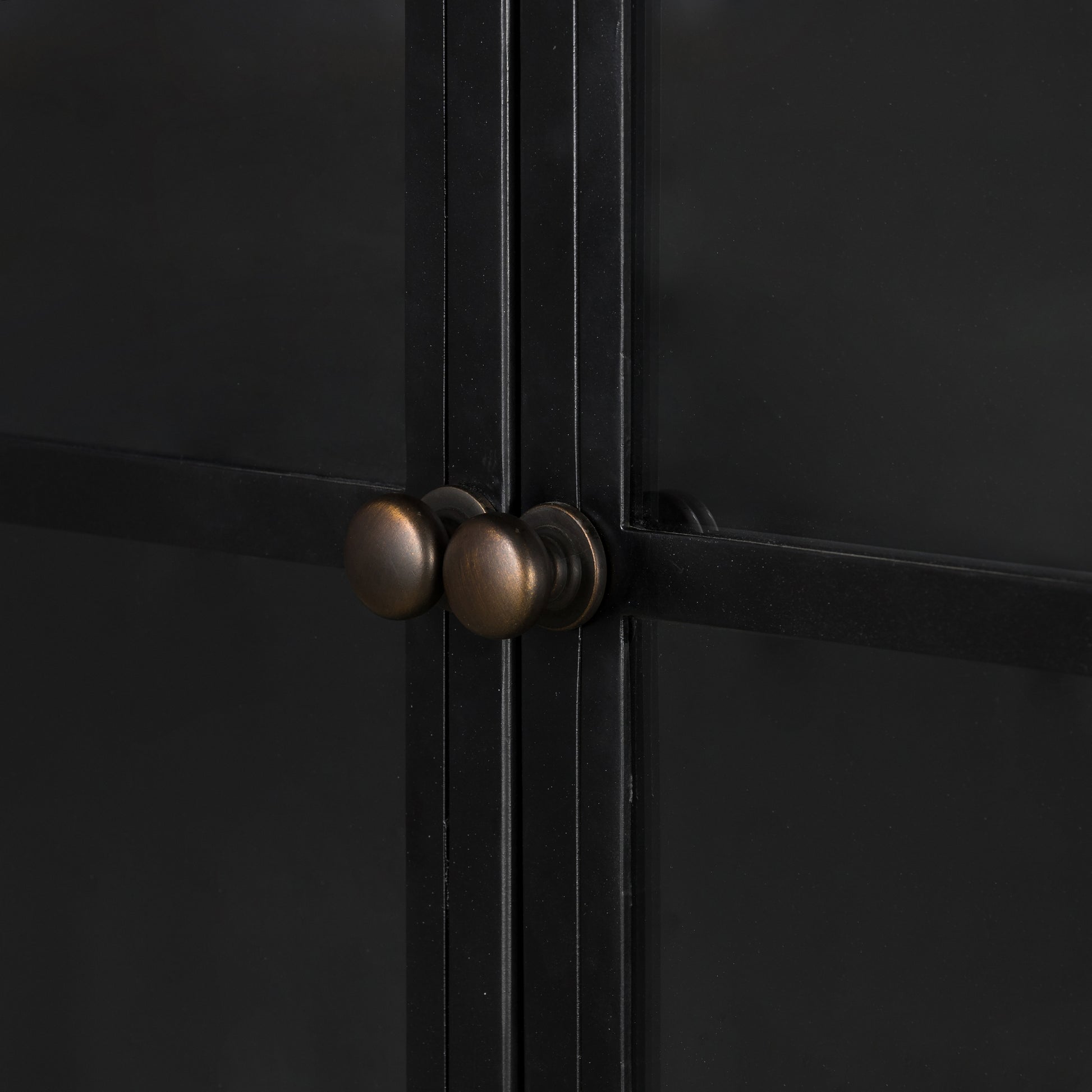 Display barware, books and keepsakes in wide, beautifully arched cabinetry. Solid iron sheeting is finished in a soft, matte black with contrasting brass hardware. Amethyst Home provides interior design, new construction, custom furniture, and area rugs in the San Diego metro area.