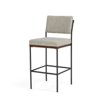 Simple and streamlined with fresh, thoughtful details. Slim, black-finished round stock iron suspends an almond-finished nettlewood deck, with a flannel-colored linen-blend seat and floating back with a rear wooden stretcher. Amethyst Home provides interior design services, furniture, rugs, and lighting in the Kansas City metro area.