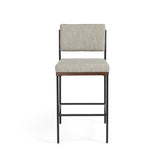 Simple and streamlined with fresh, thoughtful details. Slim, black-finished round stock iron suspends an almond-finished nettlewood deck, with a flannel-colored linen-blend seat and floating back with a rear wooden stretcher. Amethyst Home provides interior design services, furniture, rugs, and lighting in the Miami metro area.