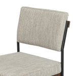 Simple and streamlined with fresh, thoughtful details. Slim, black-finished round stock iron suspends an almond-finished nettlewood deck, with a flannel-colored linen-blend seat and floating back with a rear wooden stretcher. Amethyst Home provides interior design services, furniture, rugs, and lighting in the Des Moines metro area.
