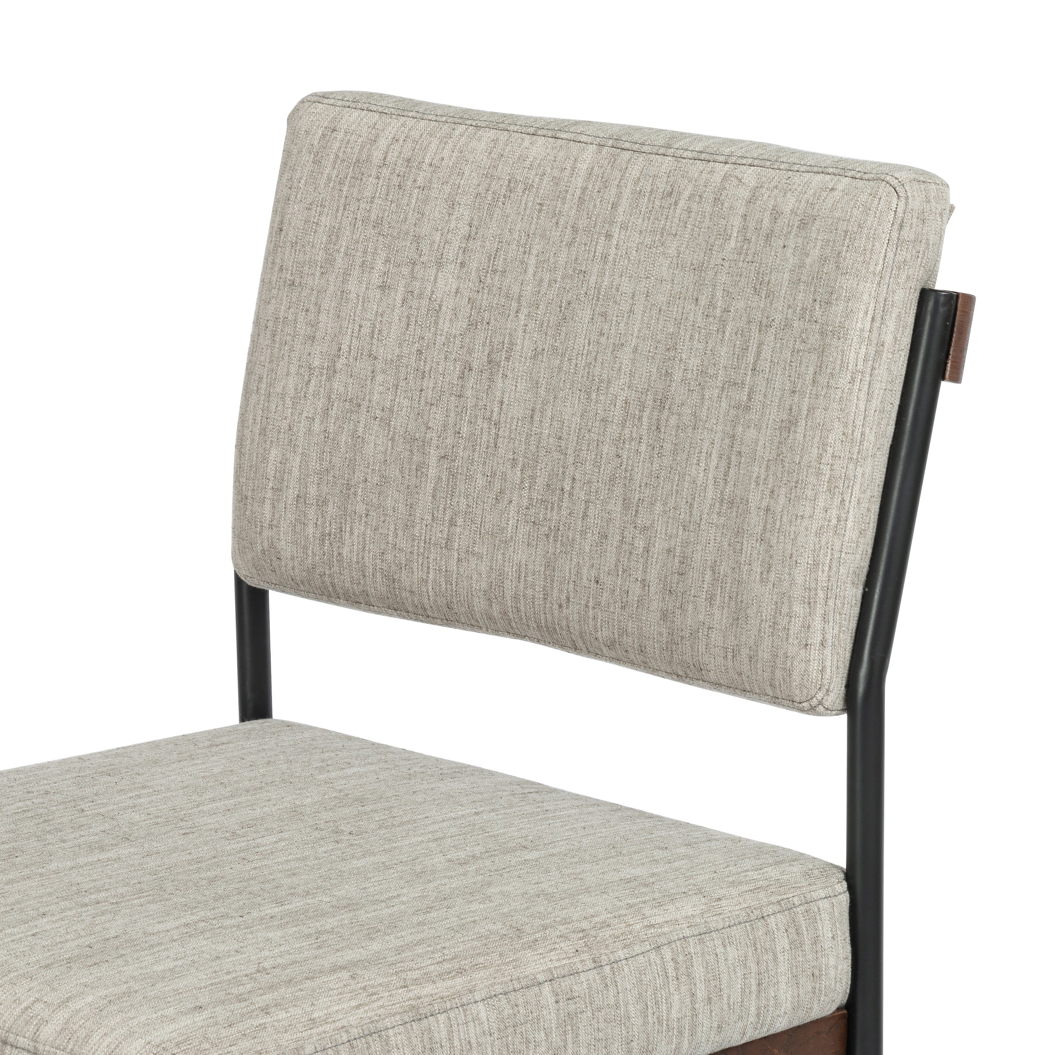 Simple and streamlined with fresh, thoughtful details. Slim, black-finished round stock iron suspends an almond-finished nettlewood deck, with a flannel-colored linen-blend seat and floating back with a rear wooden stretcher. Amethyst Home provides interior design services, furniture, rugs, and lighting in the Des Moines metro area.