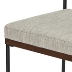 Simple and streamlined with fresh, thoughtful details. Slim, black-finished round stock iron suspends an almond-finished nettlewood deck, with a flannel-colored linen-blend seat and floating back with a rear wooden stretcher. Amethyst Home provides interior design services, furniture, rugs, and lighting in the Monterey metro area.