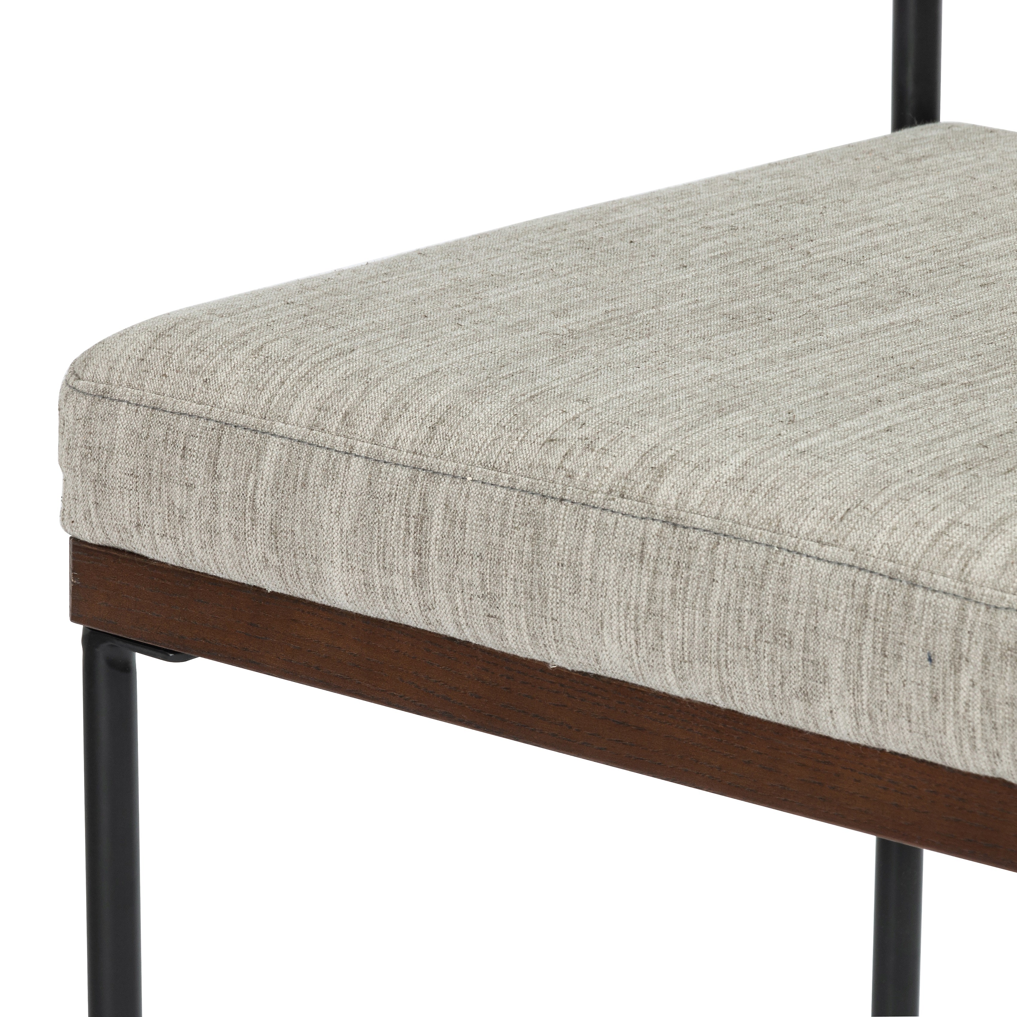 Simple and streamlined with fresh, thoughtful details. Slim, black-finished round stock iron suspends an almond-finished nettlewood deck, with a flannel-colored linen-blend seat and floating back with a rear wooden stretcher. Amethyst Home provides interior design services, furniture, rugs, and lighting in the Monterey metro area.