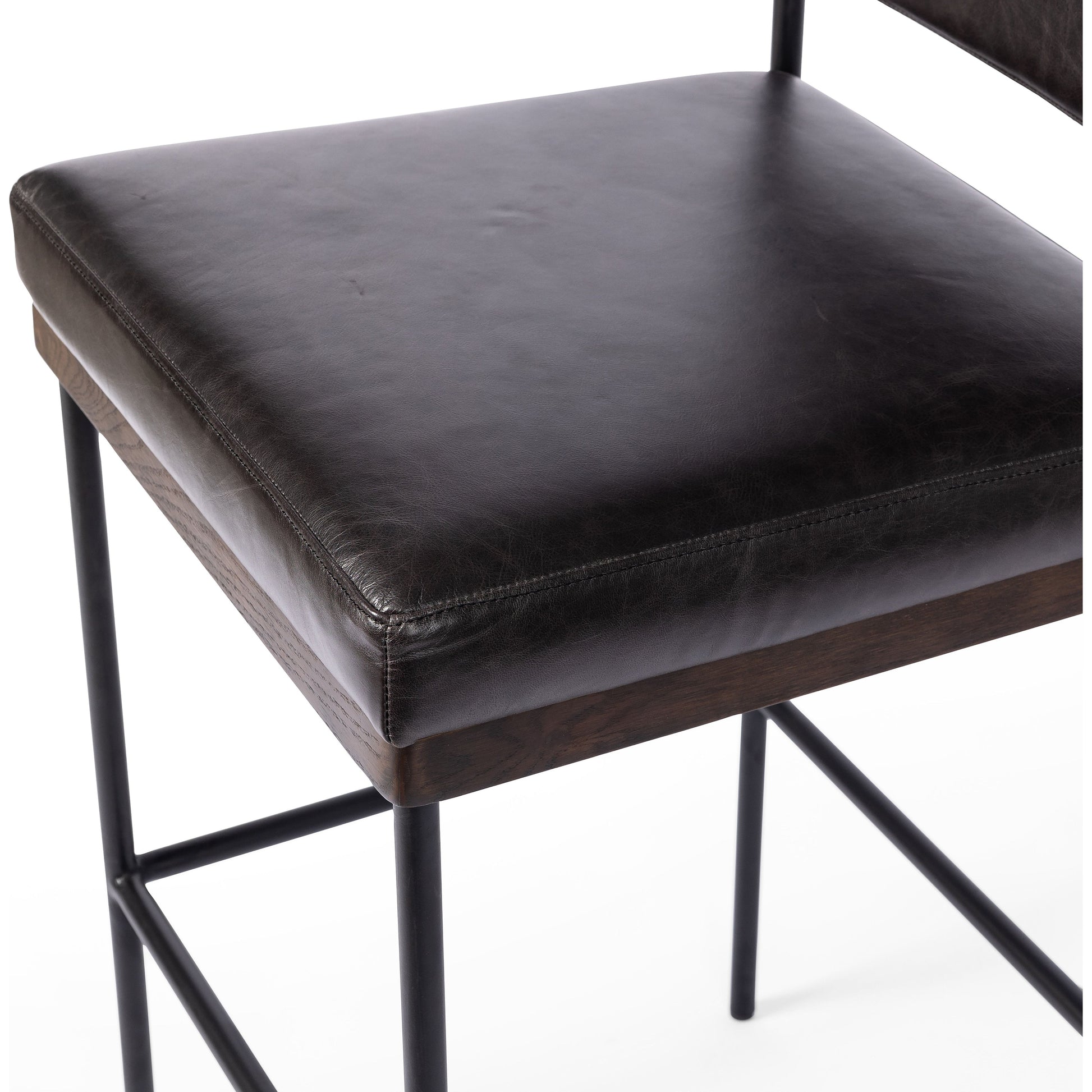 Simple and streamlined with thoughtful details. Slim, black-finished iron frame with solid oak decking, plus black top-grain leather seating for modernity. A stylish staple for any counter. Amethyst Home provides interior design, new construction, custom furniture, and area rugs in the Portland metro area.