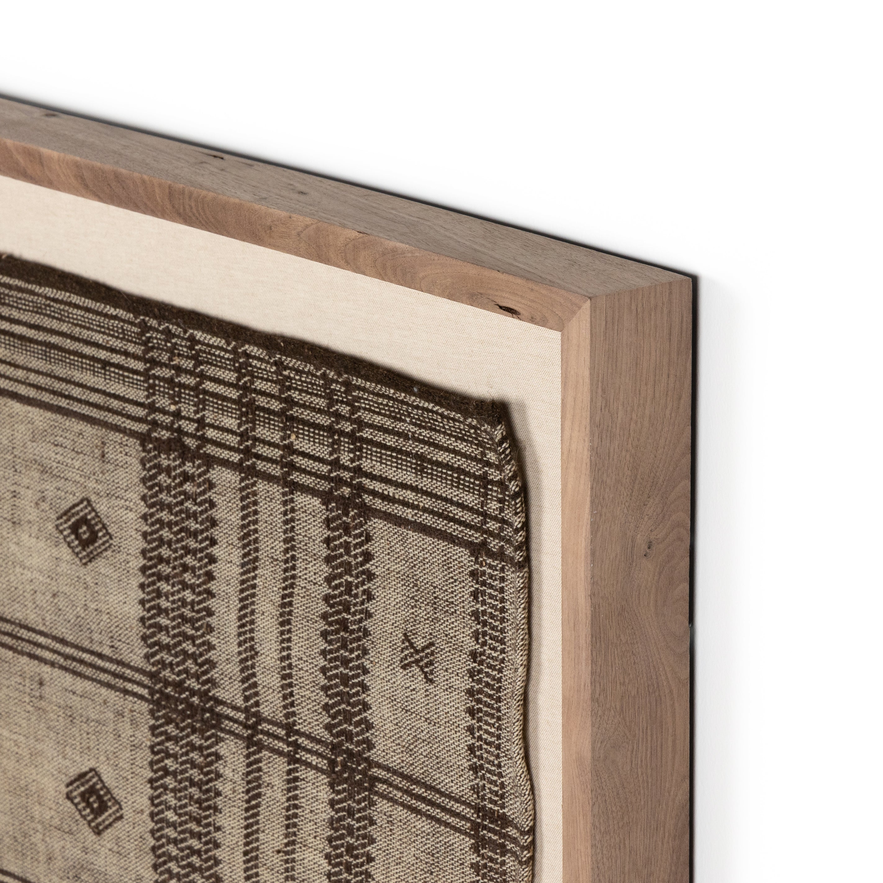Featuring Bhujodi Mocha Textile by Four Hands at Amethyst Home. A Bhujodi-style textile is framed within rustic walnut for a gallery-quality look. Handmade in Austin, Texas.Overall Dimensions: 75"W x 2.50"L x 35"HColors: Rustic 2.5 Walnut, Bhujodi MochaMaterials: Rustic Walnut, 100% Wool. Amethyst Home provides interior design, new home construction design consulting, vintage area rugs, and lighting in the Winter Garden metro area.