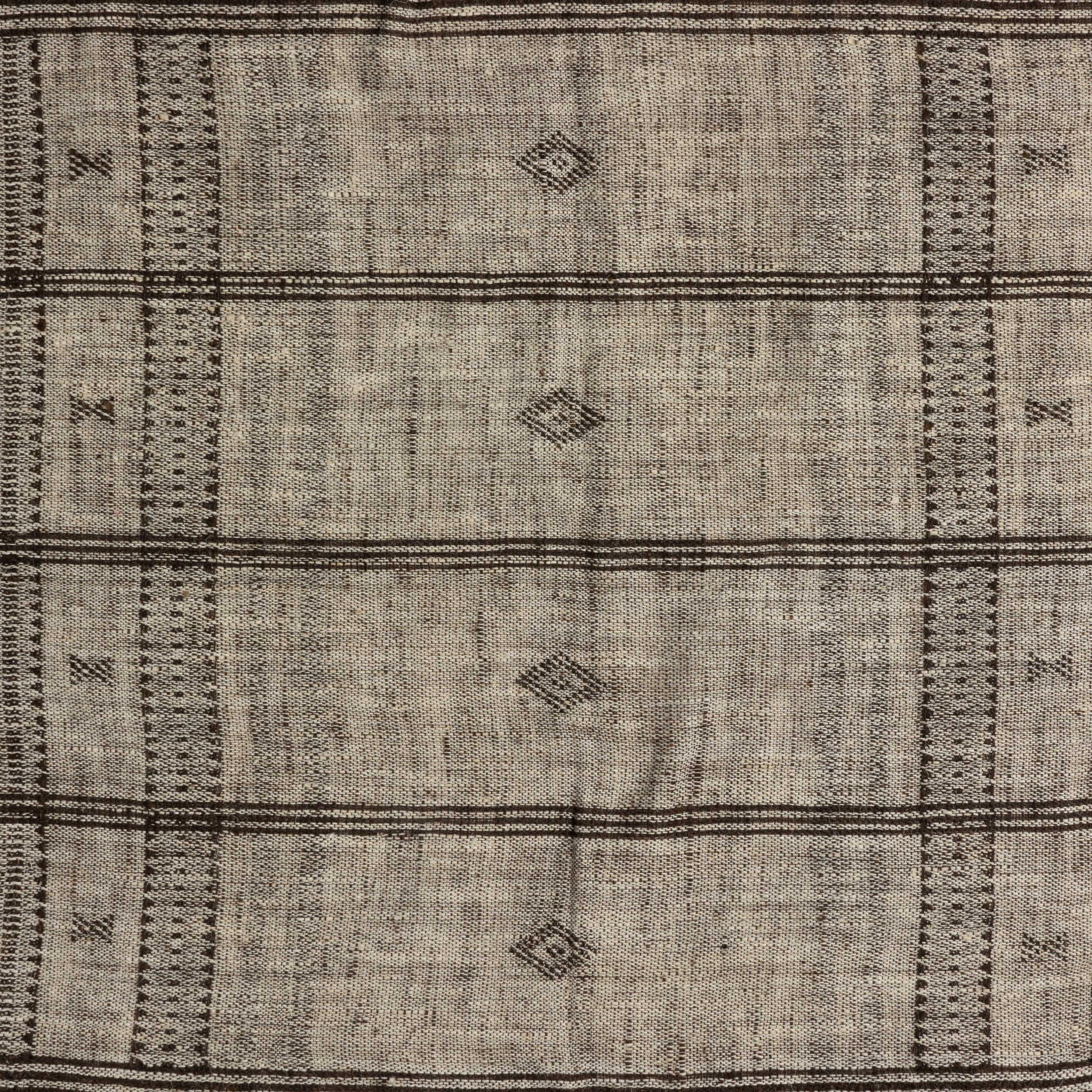 Featuring Bhujodi Mocha With Rustic Walnut Textile by Four Hands at Amethyst Home. A 500-year-old tradition comes to life on this 100% wool, handwoven textile. Crafted on a traditional frame loom following a tradition created by the Vankars of the Bhujodi village in India, a process that can take up to two days to complete. Finished with fringe tassels on b. Amethyst Home provides interior design, new home construction design consulting, vintage area rugs, and lighting in the San Diego metro area.