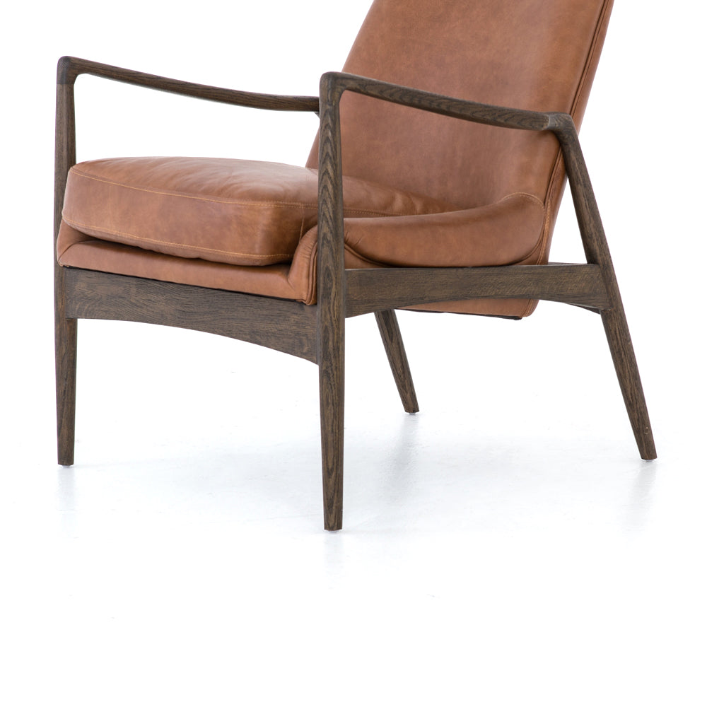 Dramatic arms and a deeper seat offer relaxation with mid-century modern sophistication. Sculpted nettlewood frame adds an architectural feel to brandy top-grain leather. Amethyst Home provides interior design, new construction, custom furniture, and area rugs in the Boston metro area.