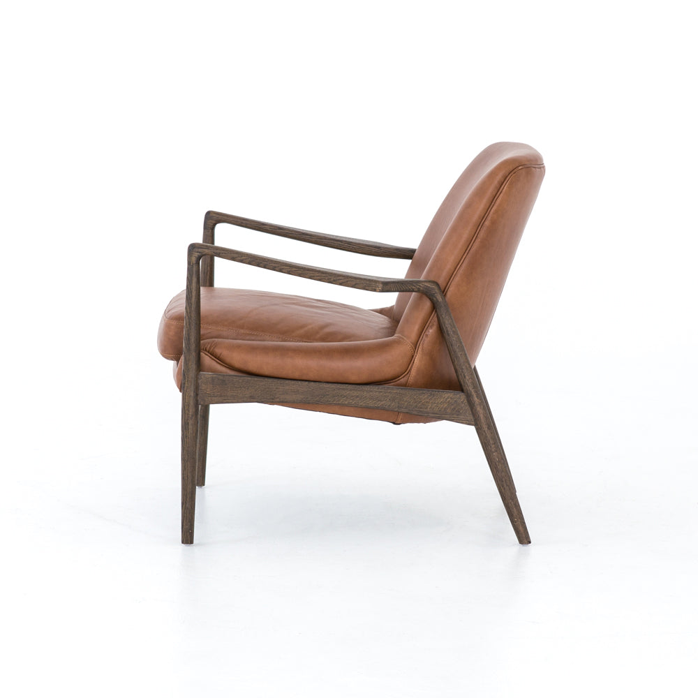 Dramatic arms and a deeper seat offer relaxation with mid-century modern sophistication. Sculpted nettlewood frame adds an architectural feel to brandy top-grain leather. Amethyst Home provides interior design, new construction, custom furniture, and area rugs in the Des Moines metro area.