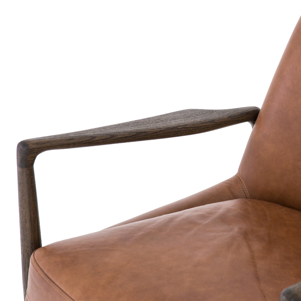 Dramatic arms and a deeper seat offer relaxation with mid-century modern sophistication. Sculpted nettlewood frame adds an architectural feel to brandy top-grain leather. Amethyst Home provides interior design, new construction, custom furniture, and area rugs in the Nashville metro area.