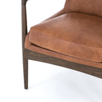 Featuring Braden Brandy Chair by Four Hands at Amethyst Home. Dramatic arms and a deeper seat offer relaxation with mid-century modern sophistication. Sculpted nettlewood frame adds an architectural feel to brandy top-grain leather.Overall Dimensions: 27.25"W x 30.25"L x 32.25"H
Collection: AshfordColors: Brandy ,Warm OakMaterials: Top Grain Leather ,Solid Oak Weight: 29.32 l. Amethyst Home provides interior design, new construction, custom furniture, and area rugs in the Newport Beach metro area.