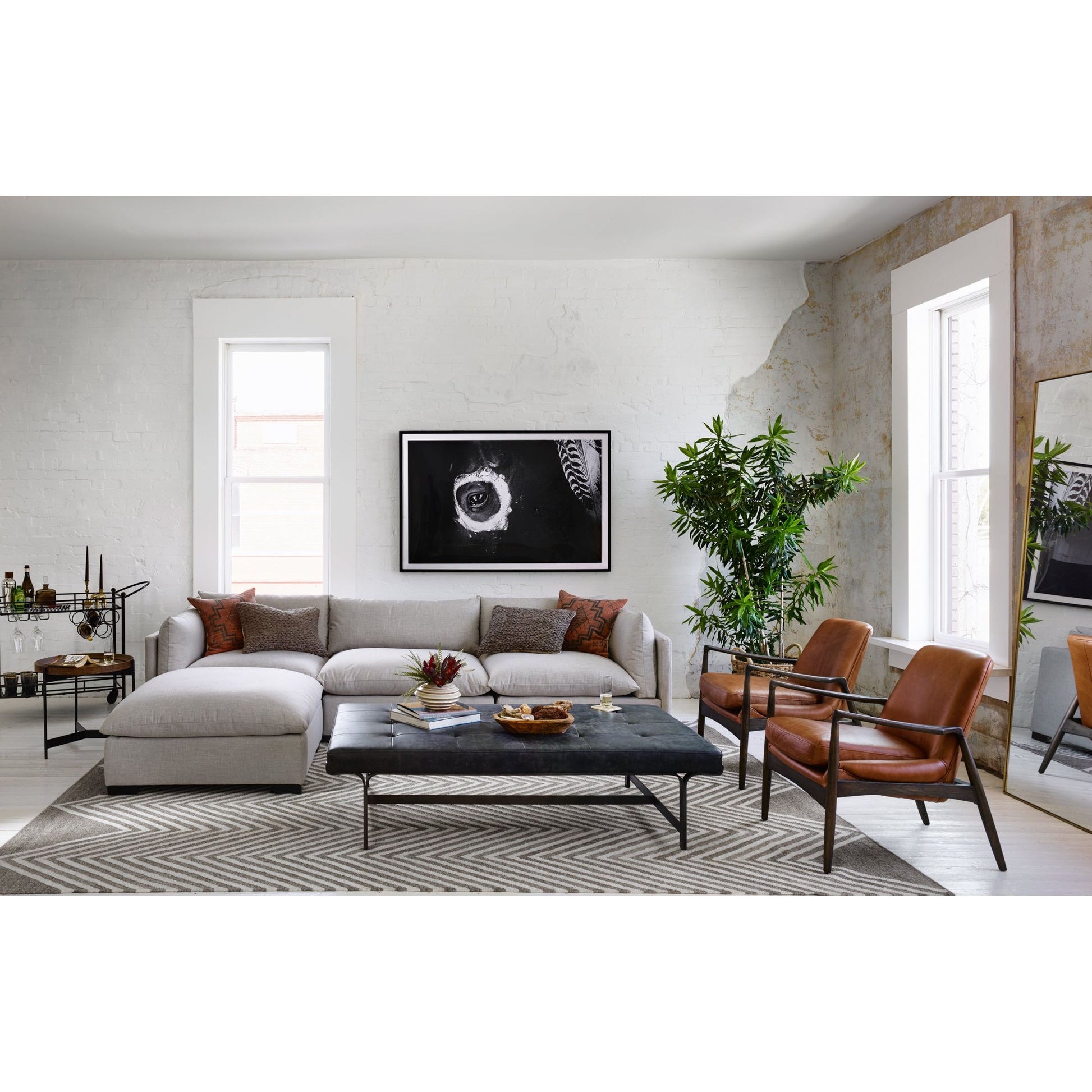 Dramatic arms and a deeper seat offer relaxation with mid-century modern sophistication. Sculpted nettlewood frame adds an architectural feel to brandy top-grain leather. Amethyst Home provides interior design, new construction, custom furniture, and area rugs in the Salt Lake City metro area.