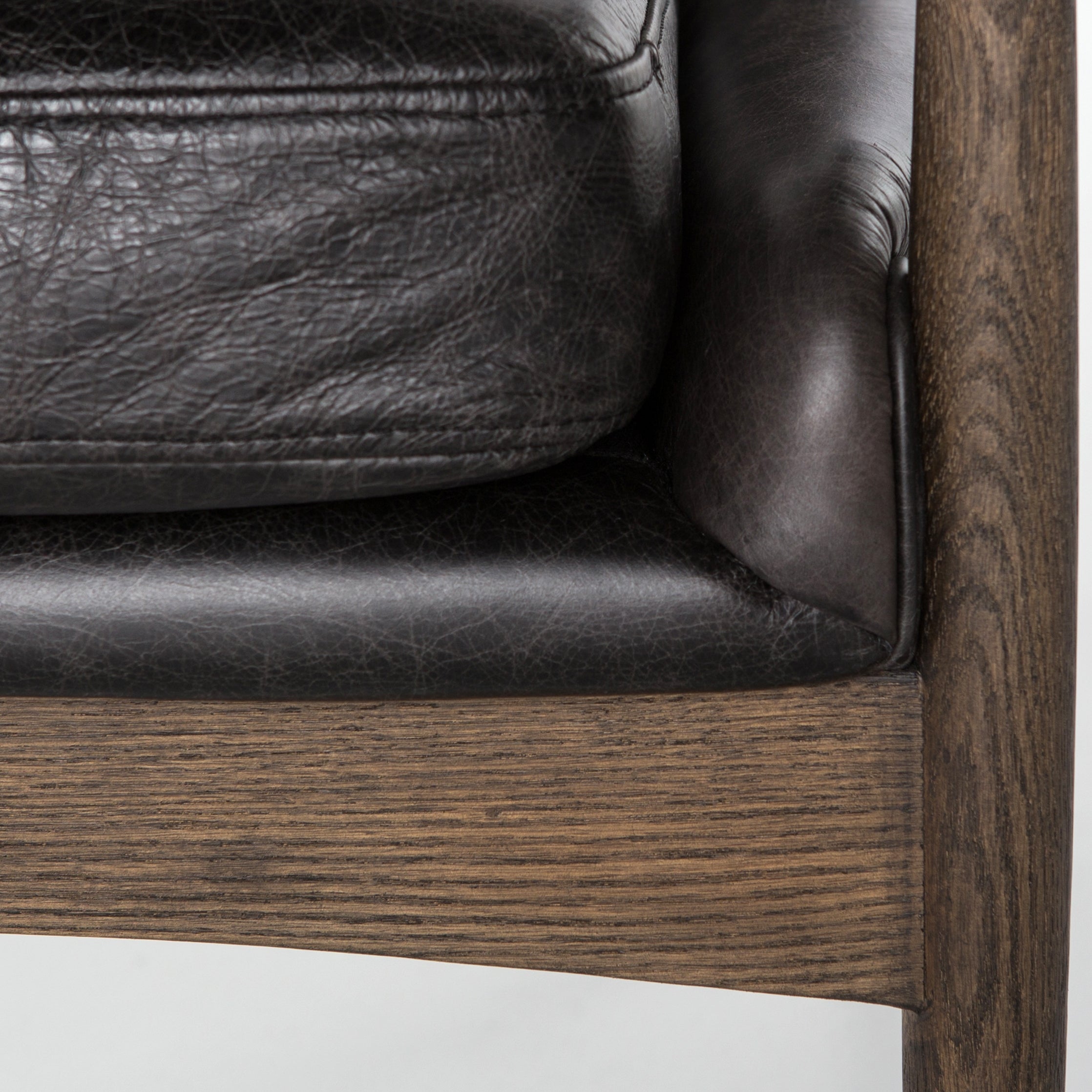 Featuring Braden Durango Smoke Chair by Four Hands at Amethyst Home. Dramatic arms and a deeper seat offer relaxation with mid-century modern sophistication. Sculpted frame adds an architectural feel to rich, black top-grain leather.Overall Dimensions: 27.25"W x 30.25"L x 32.25"H
Collection: AshfordColors: Durango Smoke ,Warm OakMaterials: Top Grain Leather ,Solid Oak Weight: 29. Amethyst Home provides interior design, new construction, custom furniture, and area rugs in the Alpharetta metro area.
