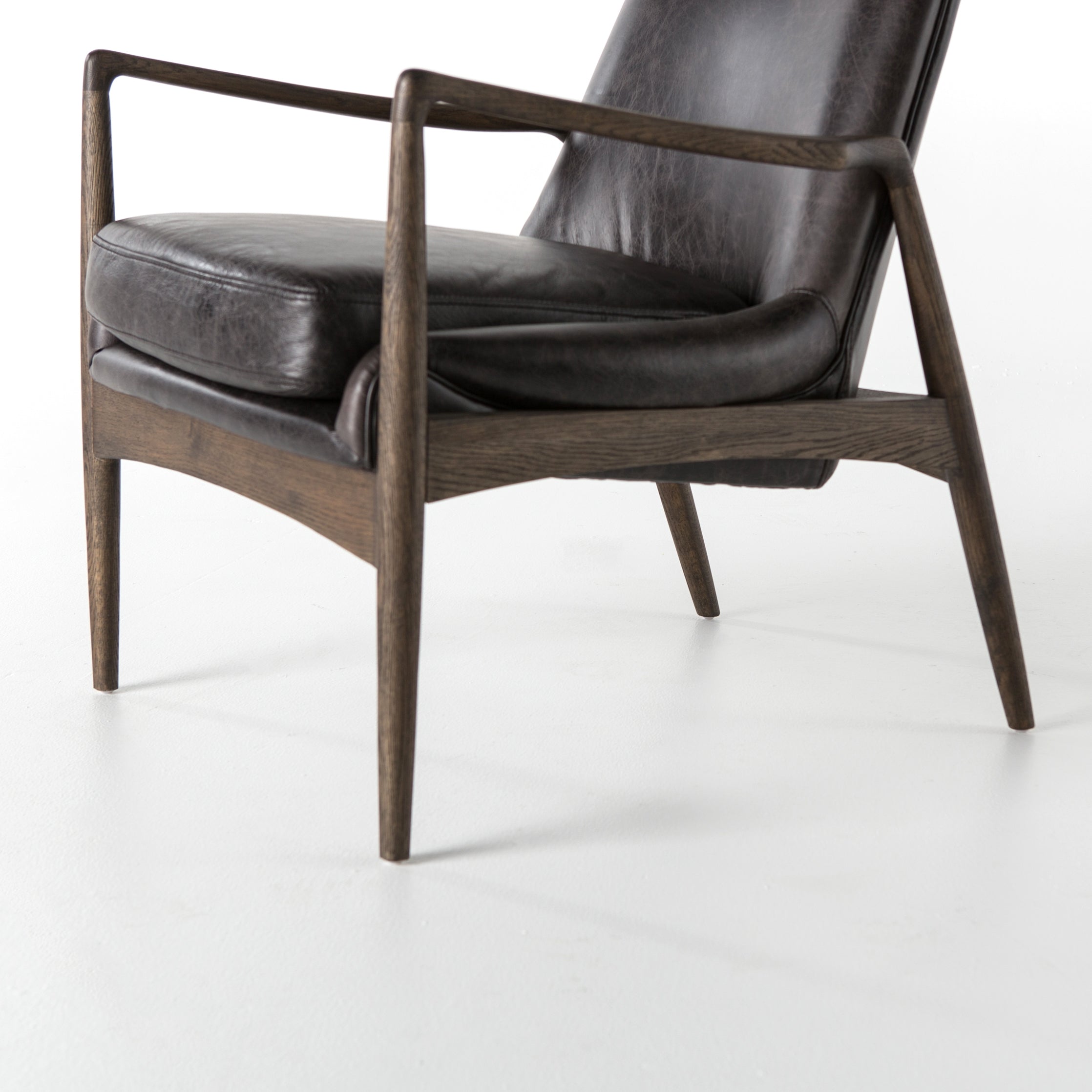 Featuring Braden Durango Smoke Chair by Four Hands at Amethyst Home. Dramatic arms and a deeper seat offer relaxation with mid-century modern sophistication. Sculpted frame adds an architectural feel to rich, black top-grain leather.Overall Dimensions: 27.25"W x 30.25"L x 32.25"H
Collection: AshfordColors: Durango Smoke ,Warm OakMaterials: Top Grain Leather ,Solid Oak Weight: 29.32 . Amethyst Home provides interior design, new construction, custom furniture, and area rugs in the Dallas metro area.