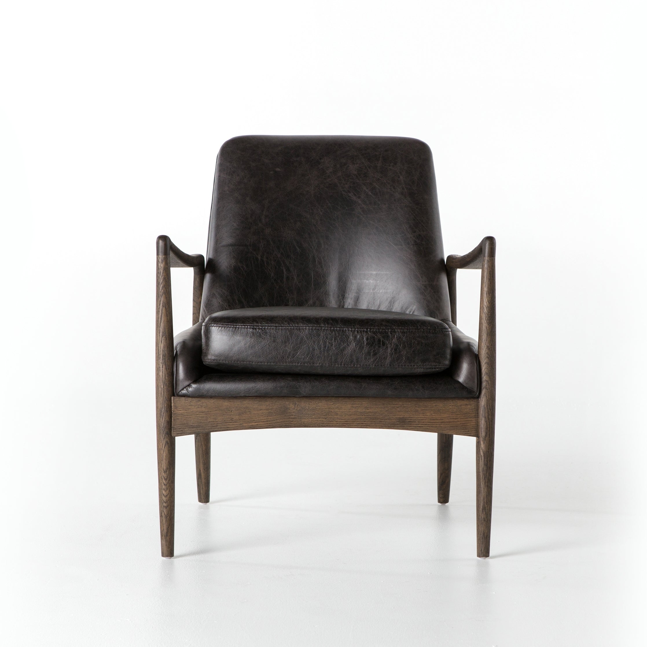 Featuring Braden Durango Smoke Chair by Four Hands at Amethyst Home. Dramatic arms and a deeper seat offer relaxation with mid-century modern sophistication. Sculpted frame adds an architectural feel to rich, black top-grain leather.Overall Dimensions: 27.25"W x 30.25"L x 32.25"H
Collection: AshfordColors: Durango Smoke ,Warm OakMaterials: Top Grain Leather ,Solid Oak Weight: 2. Amethyst Home provides interior design, new construction, custom furniture, and area rugs in the Los Angeles metro area.