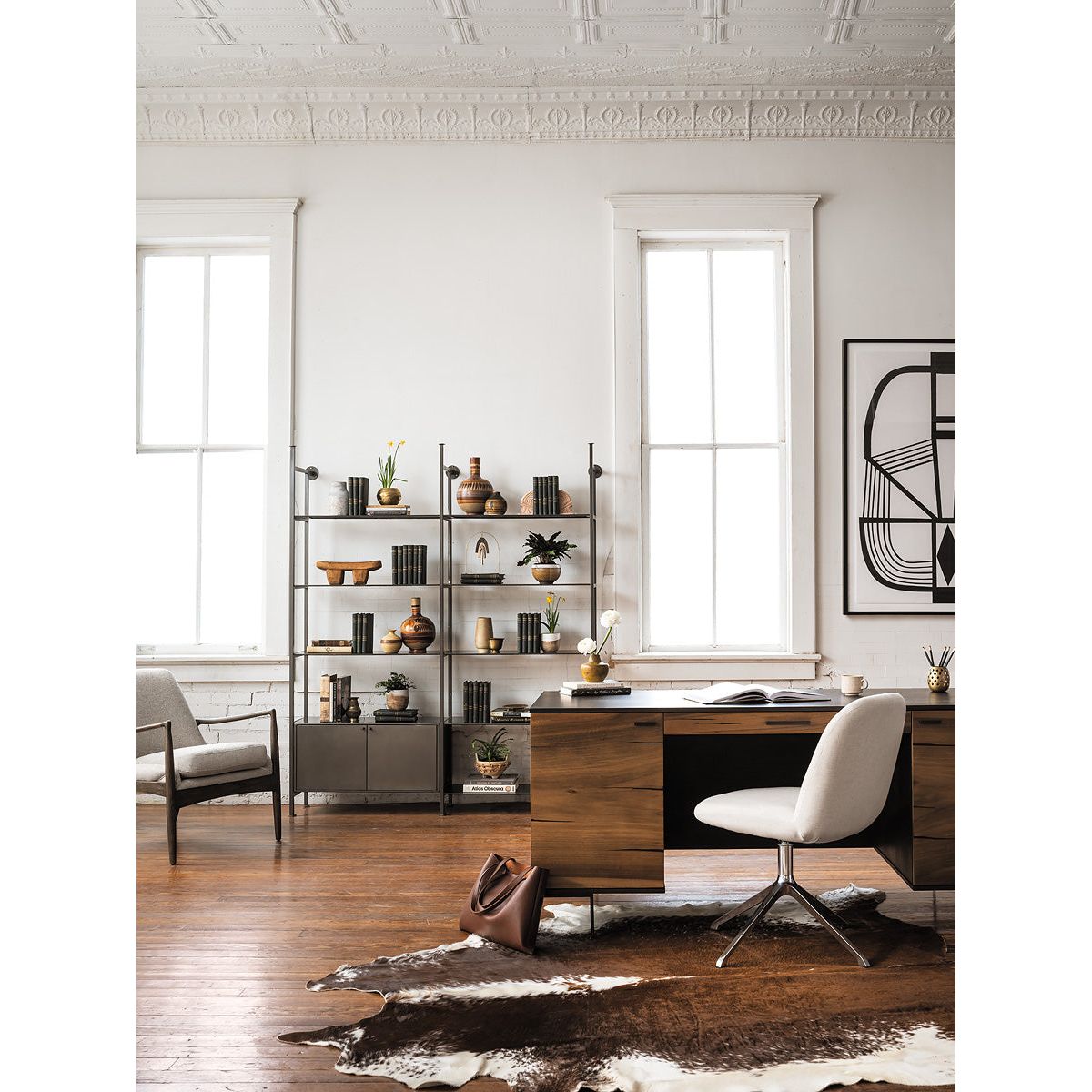 Dramatic arms and a deeper seat offer relaxation with mid-century modern sophistication. Sculpted frame adds an architectural feel to light camel upholstery. Amethyst Home provides interior design, new construction, custom furniture, and area rugs in the Laguna Beach metro area.