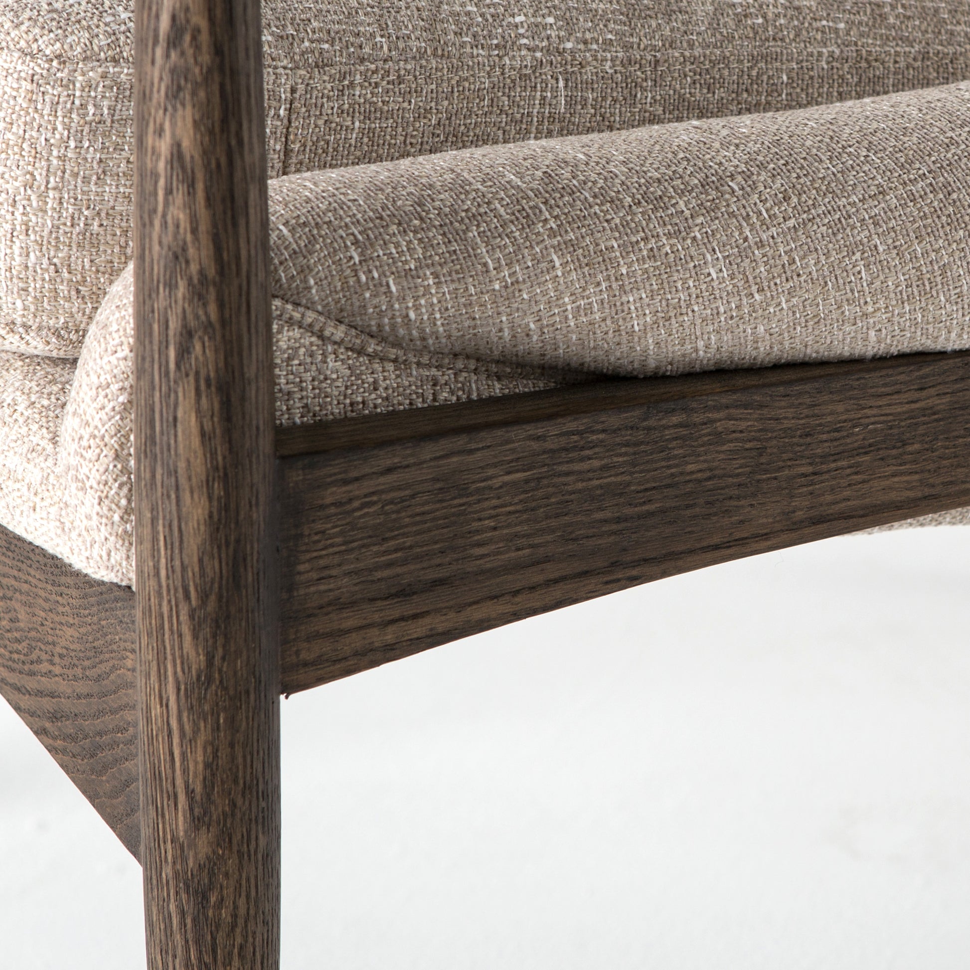 Dramatic arms and a deeper seat offer relaxation with mid-century modern sophistication. Sculpted frame adds an architectural feel to light camel upholstery. Amethyst Home provides interior design, new construction, custom furniture, and area rugs in the Monterey metro area.