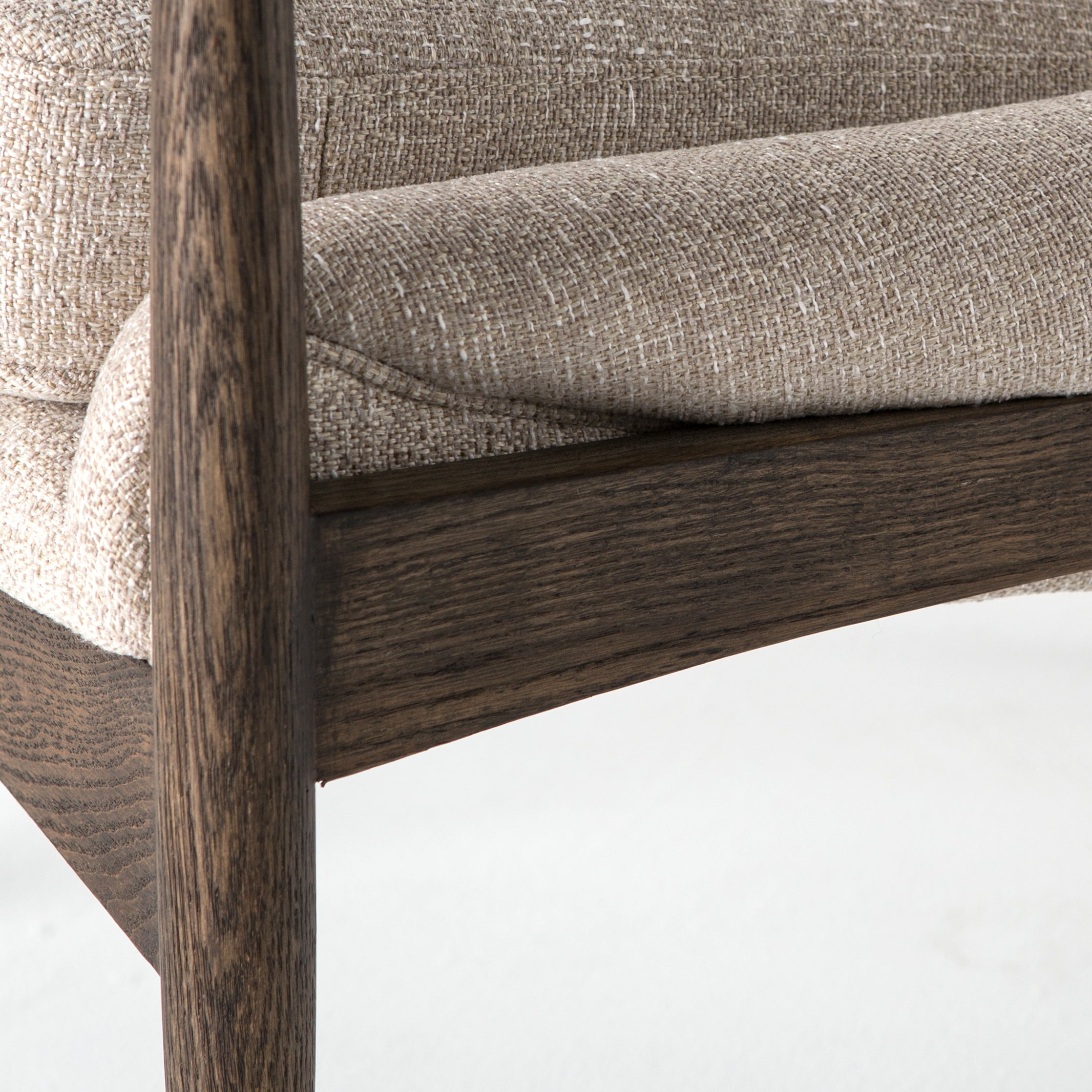 Dramatic arms and a deeper seat offer relaxation with mid-century modern sophistication. Sculpted frame adds an architectural feel to light camel upholstery. Amethyst Home provides interior design, new construction, custom furniture, and area rugs in the Monterey metro area.