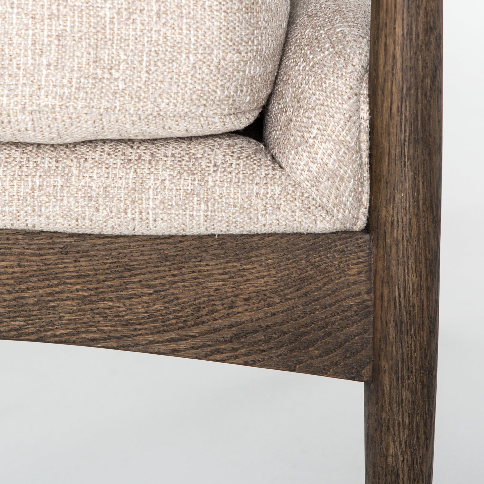Dramatic arms and a deeper seat offer relaxation with mid-century modern sophistication. Sculpted frame adds an architectural feel to light camel upholstery. Amethyst Home provides interior design, new construction, custom furniture, and area rugs in the Newport Beach metro area.
