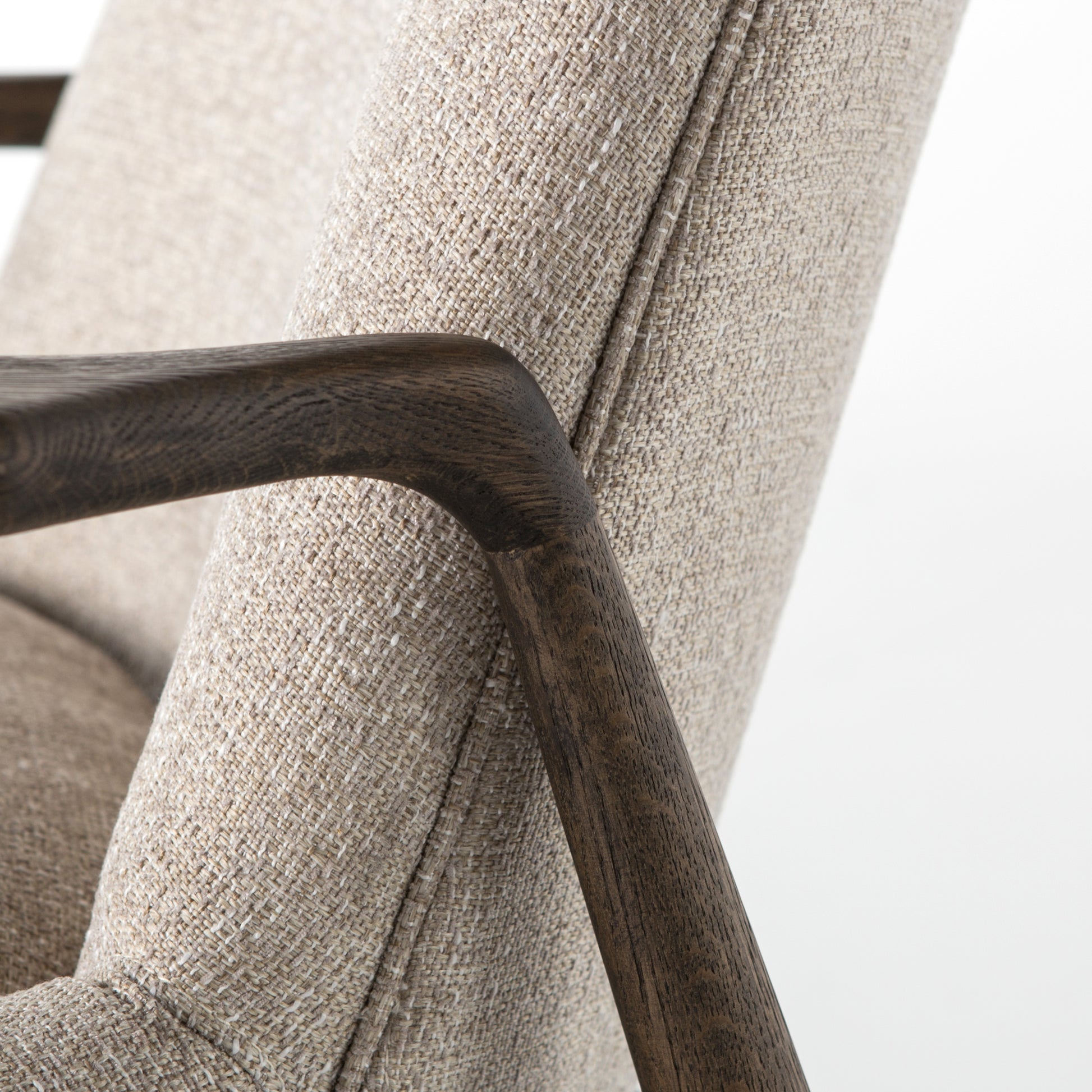 Dramatic arms and a deeper seat offer relaxation with mid-century modern sophistication. Sculpted frame adds an architectural feel to light camel upholstery. Amethyst Home provides interior design, new construction, custom furniture, and area rugs in the Scottsdale metro area.