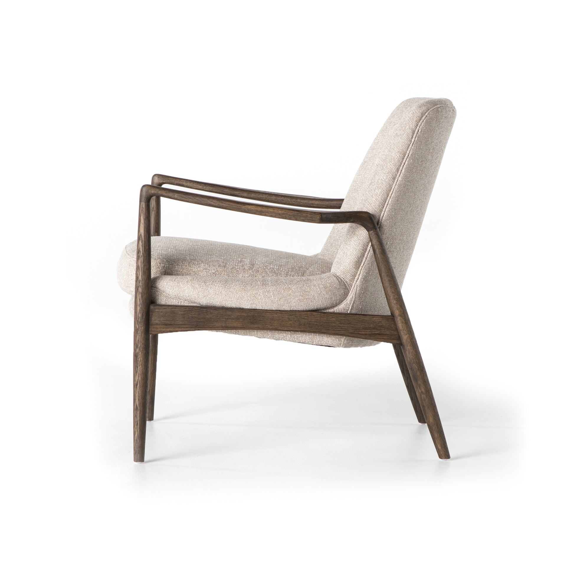Dramatic arms and a deeper seat offer relaxation with mid-century modern sophistication. Sculpted frame adds an architectural feel to light camel upholstery. Amethyst Home provides interior design, new construction, custom furniture, and area rugs in the Seattle metro area.