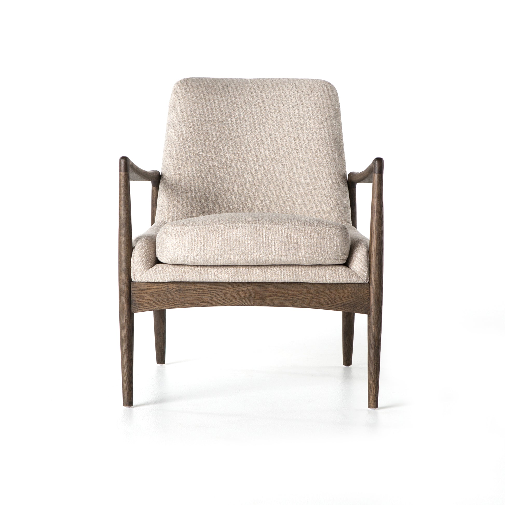 Dramatic arms and a deeper seat offer relaxation with mid-century modern sophistication. Sculpted frame adds an architectural feel to light camel upholstery. Amethyst Home provides interior design, new construction, custom furniture, and area rugs in the Winter Garden metro area.