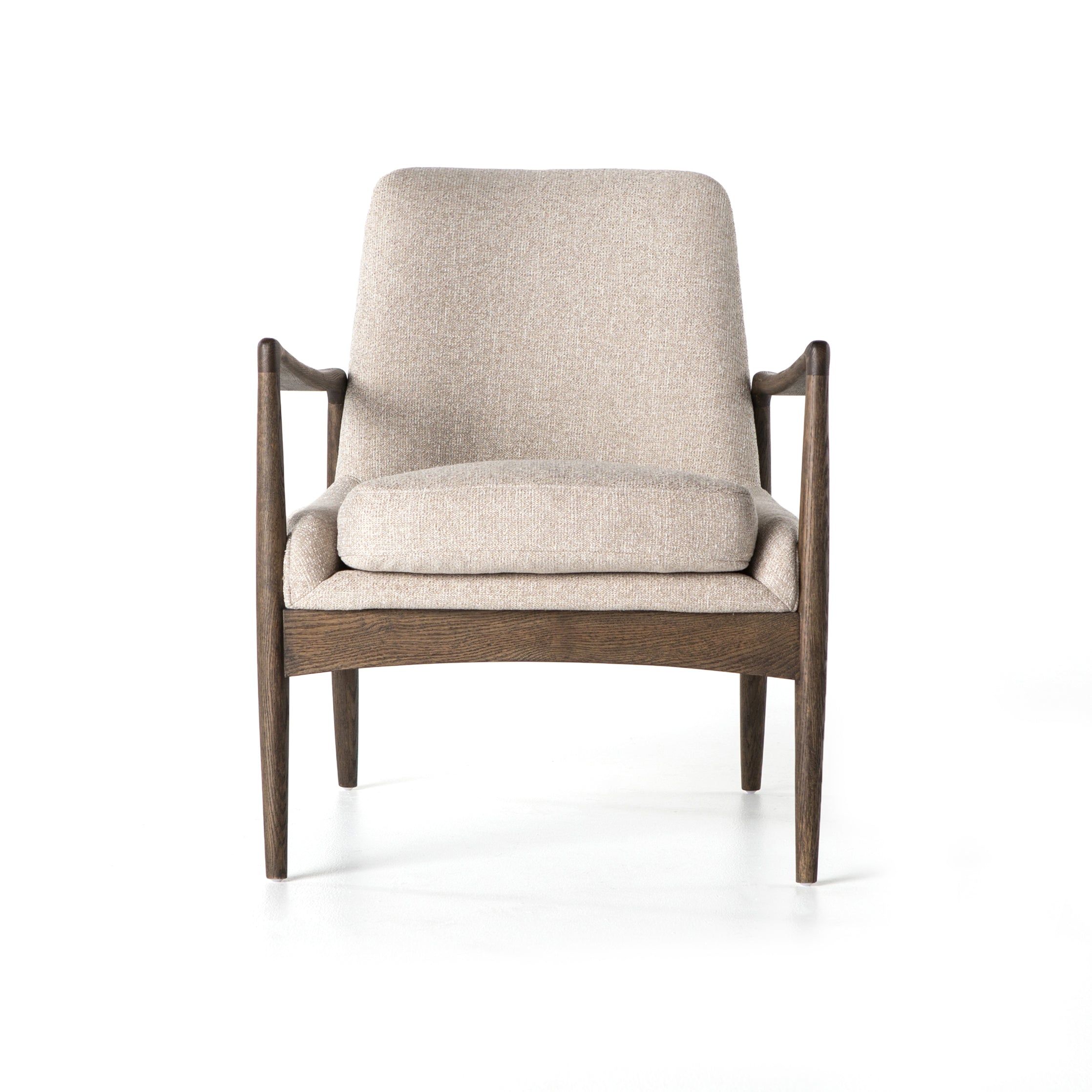 Dramatic arms and a deeper seat offer relaxation with mid-century modern sophistication. Sculpted frame adds an architectural feel to light camel upholstery. Amethyst Home provides interior design, new construction, custom furniture, and area rugs in the Winter Garden metro area.