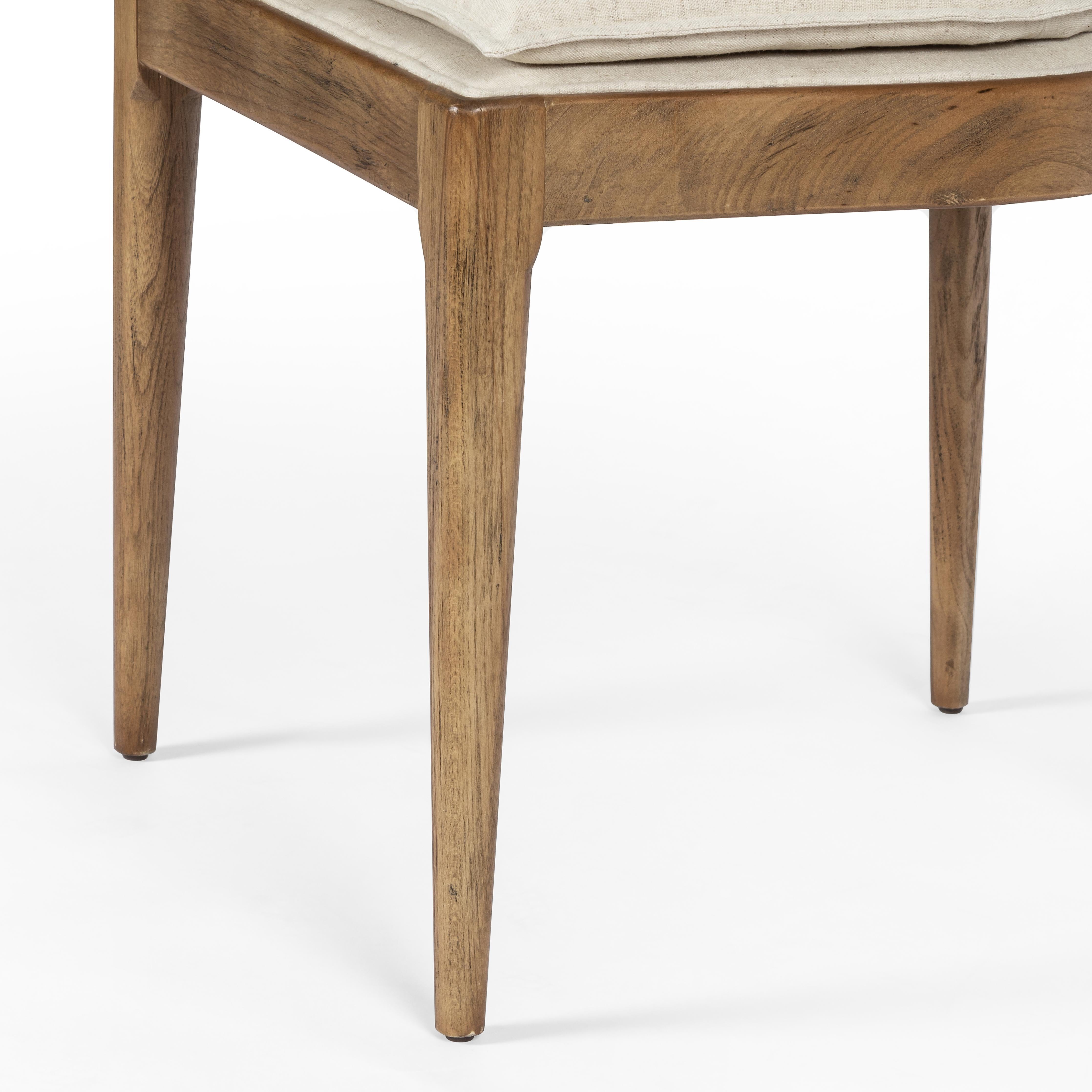 Mixed materials refresh retro dining style. Light-toasted nettlewood frames a textural inlay of natural cane, for perfect contrast. Fastened by Velcro, high-performance linen-blend seating for modern sensibility. Amethyst Home provides interior design, new home construction design consulting, vintage area rugs, and lighting in the Laguna Beach metro area.