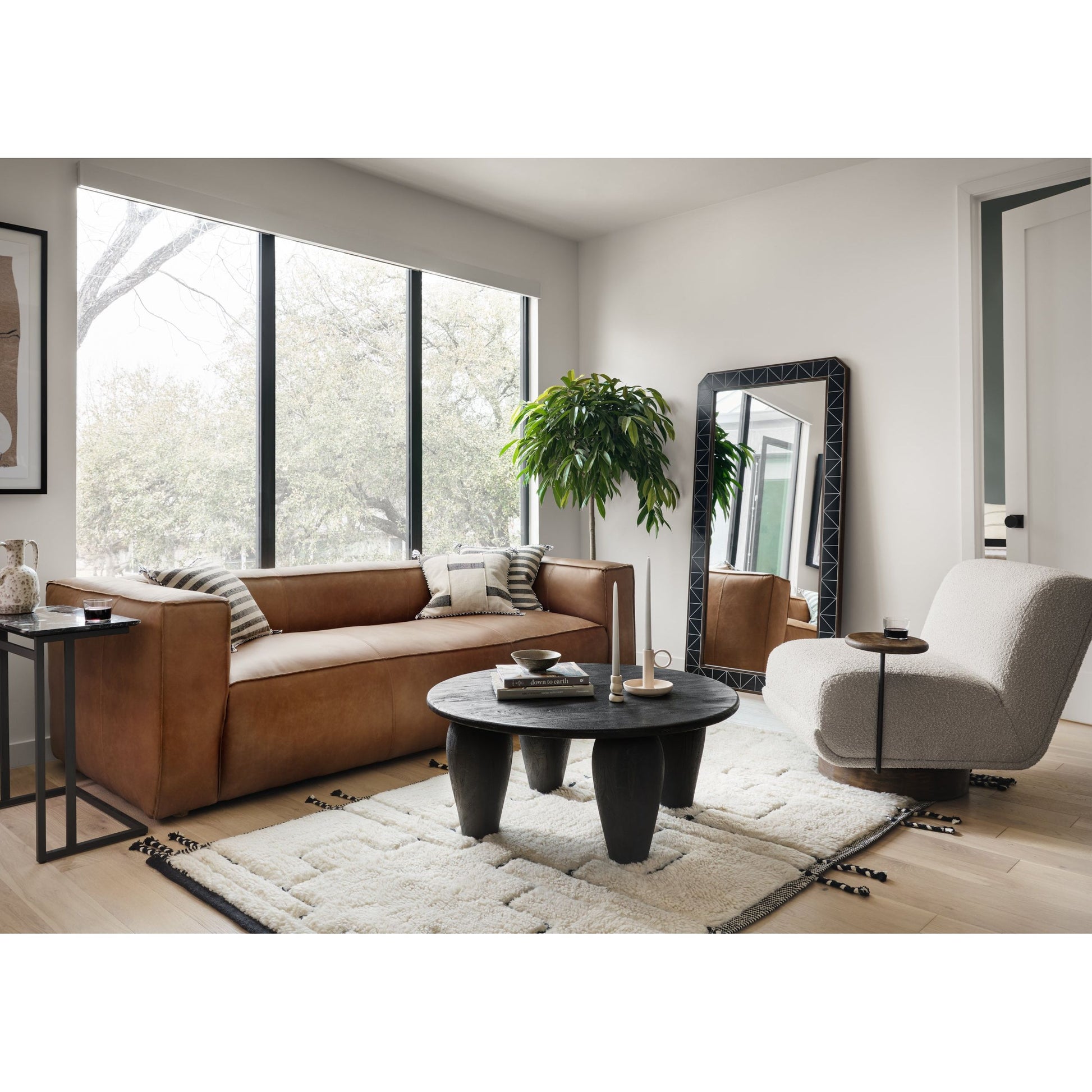 A stylish play on function. With chunky, cream-colored upholstery, armless accent seating tops a parawood 360-degree swivel base, wire-brushed for vintage vibes. Option to pair with matching side table, which can be fastened or removed from either side with ease. Amethyst Home provides interior design, new construction, custom furniture, and area rugs in the Nashville metro area.