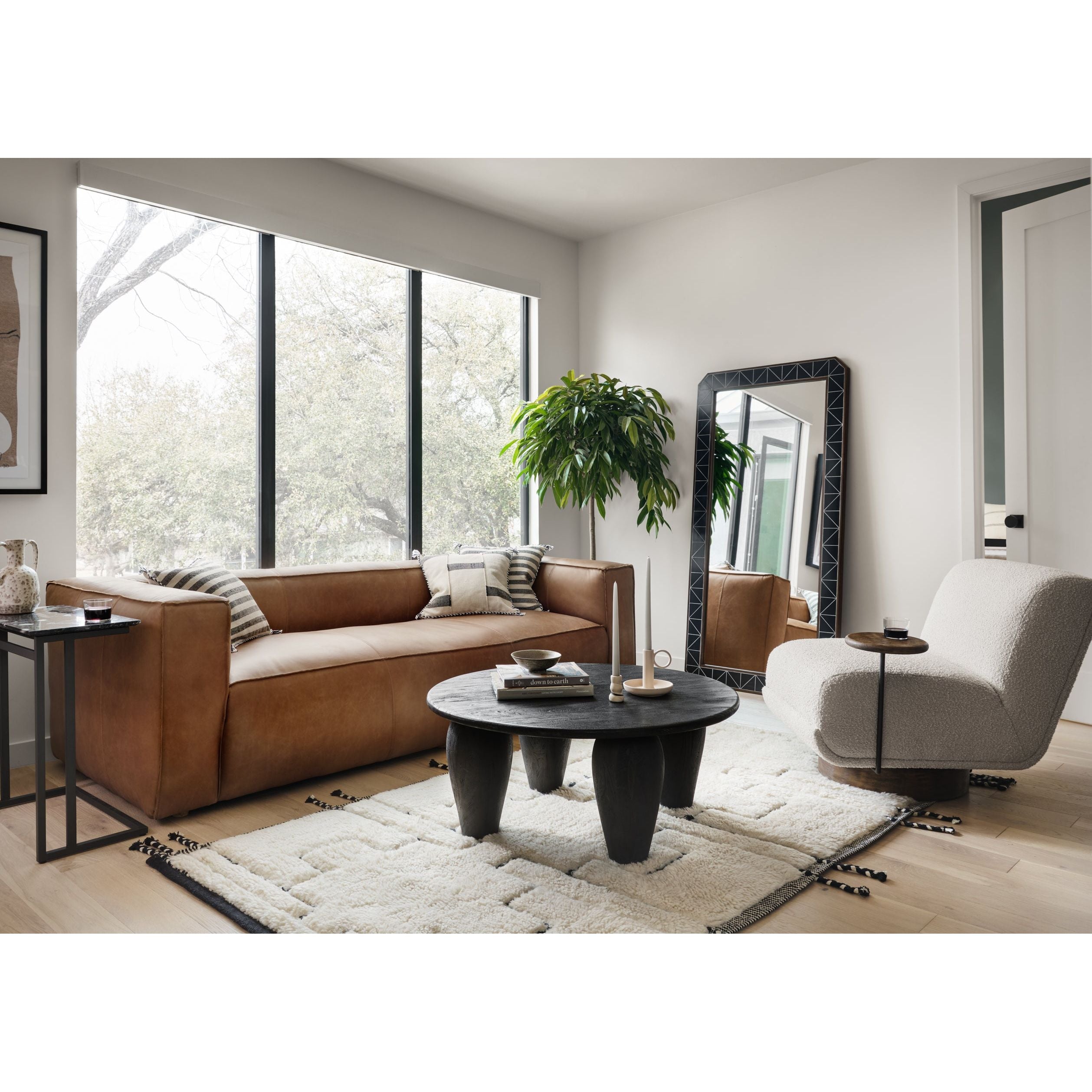 A stylish play on function. With chunky, cream-colored upholstery, armless accent seating tops a parawood 360-degree swivel base, wire-brushed for vintage vibes. Option to pair with matching side table, which can be fastened or removed from either side with ease. Amethyst Home provides interior design, new construction, custom furniture, and area rugs in the Nashville metro area.